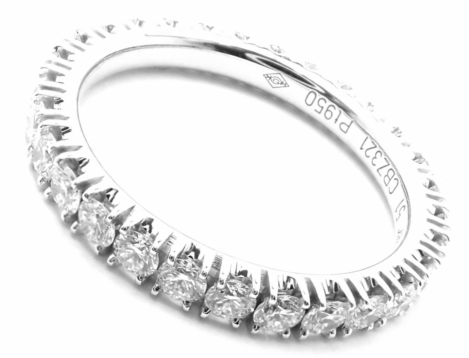 Platinum Diamond Étincelle De Cartier Eternity Band Ring by Cartier.
With 29 round brilliant cut diamonds VVS1 clarity, E color total weight approximately 0.94ct 
Details:
Size: European 51, US 5.75
Weight: 3.2 grams
Width: 2.6mm
Stamped Hallmarks: