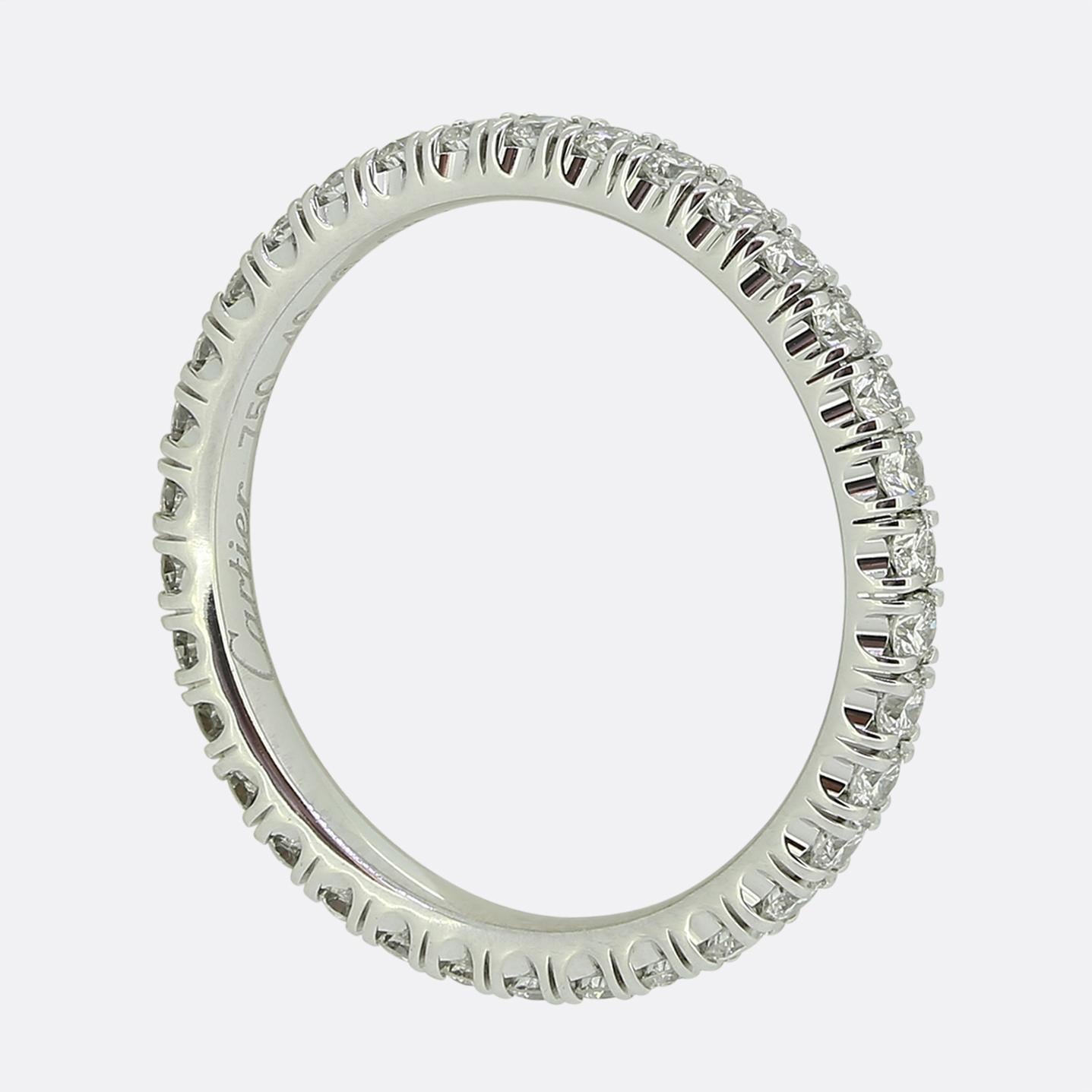 Here we have a classic diamond full eternity ring from the world renowned jewellery house of Cartier. The band has been crafted from 18ct white gold and plays host to 34 round brilliant cut diamonds; all of which have been individually claw set in a