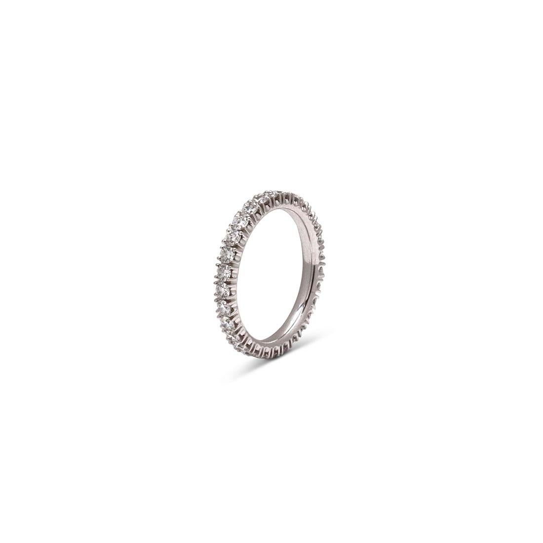 Authentic Cartier 'Étincelle de Cartier' wedding band crafted in platinum, set with round brilliant cut diamonds weighing an estimated 0.93 carats. Signed Cartier, 51, PT950, with serial number and hallmarks. Ring size 51 (US 5 3/4). The ring is