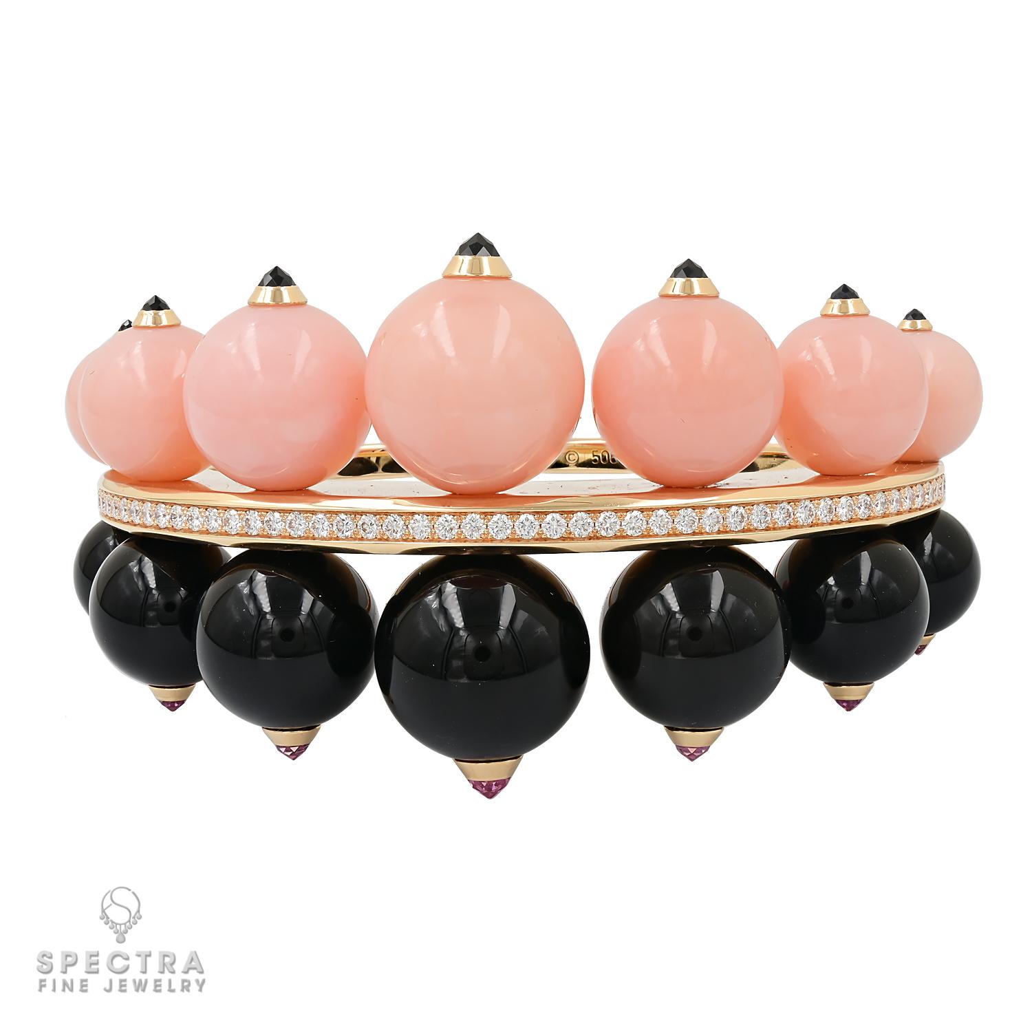 Presenting this Pink Opal Onyx Diamond Bangle made by Cartier in 2010s - a sublime expression of opulence and sophistication. This luxurious creation harmoniously combines the enduring charm of pink opal, black onyx, and radiant diamonds, all