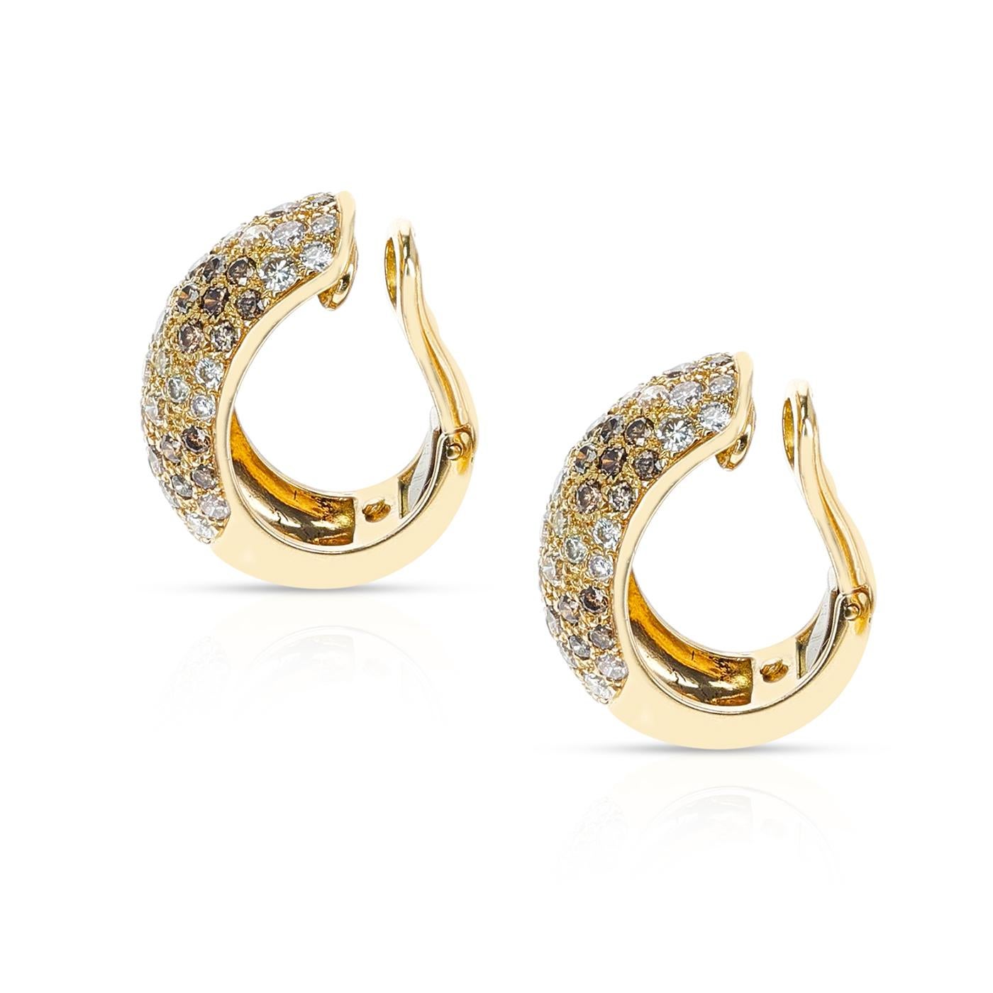 A Cartier Fancy Color Diamonds Bombé Earring pair with diamonds colors such as brown and white. Has a matching ring. The diamonds weigh appx. 3 carats. The length is 0.75 inches. Signed Cartier.
 