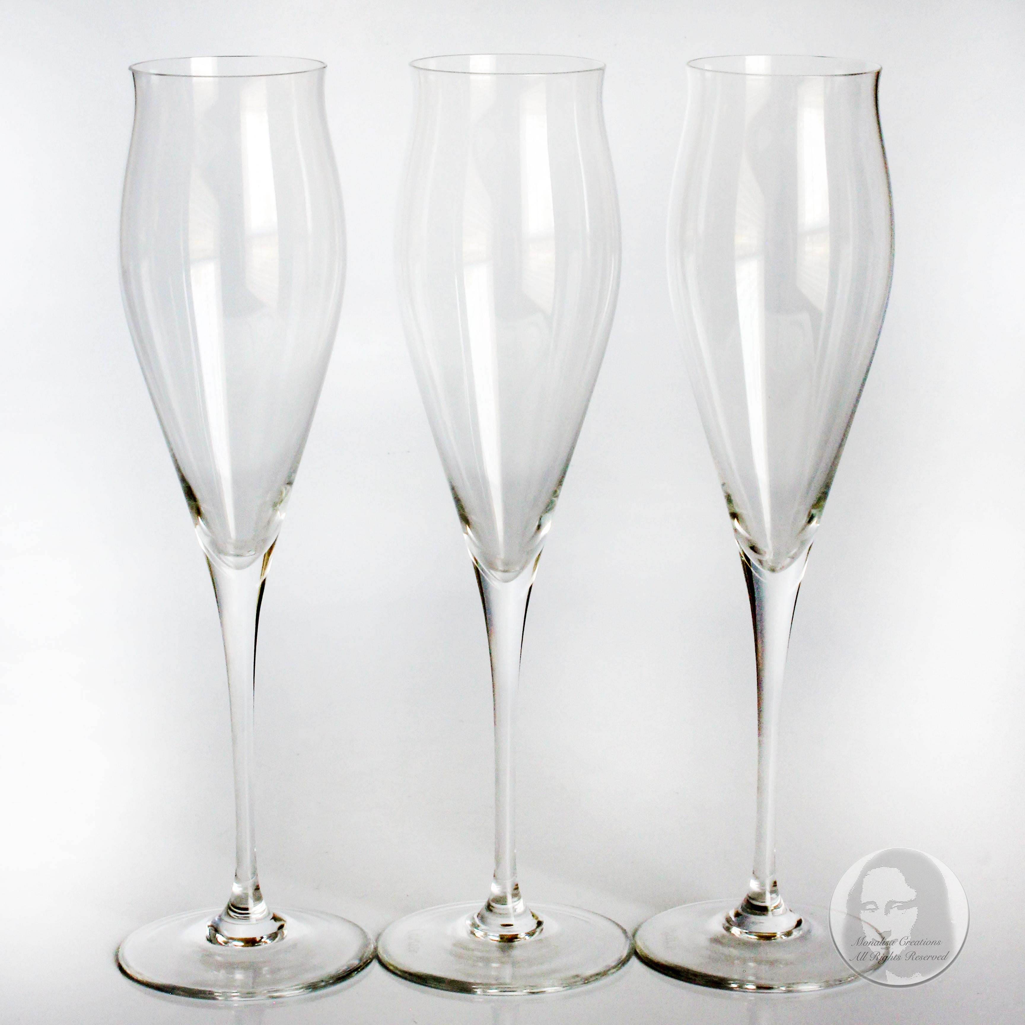 Authentic, preowned, vintage Cartier fluted champagne glasses, likely made in the 90s. Made from crystal, these luxe champagne glasses are perfect for the home bar or for whenever you want to entertain in style! No box but will be carefully packaged