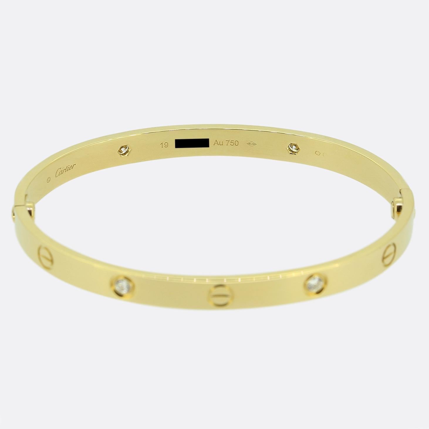 Here we have an 18ct yellow gold bangle from the world renowned luxury jewellery house of Cartier. This bangle forms part of the LOVE collection and features four round brilliant cut diamonds alongside the iconic screw motif.

