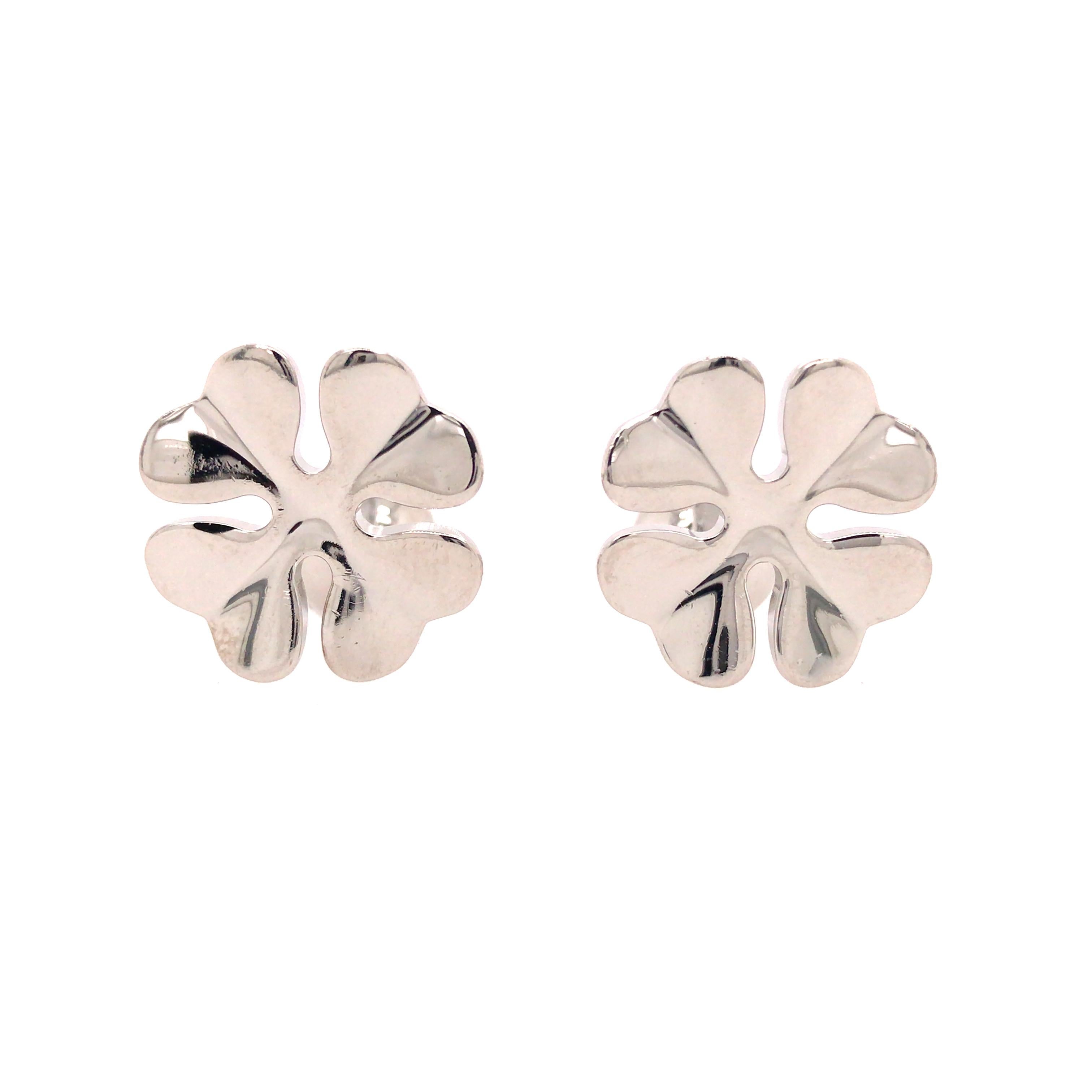Cartier Four Leaf Clover Cuff Links in Sterling Silver.  The Cuff Links measure 3/4 inch in length and 5/8 inch in width at the top. 14.1 grams. Inscribed 