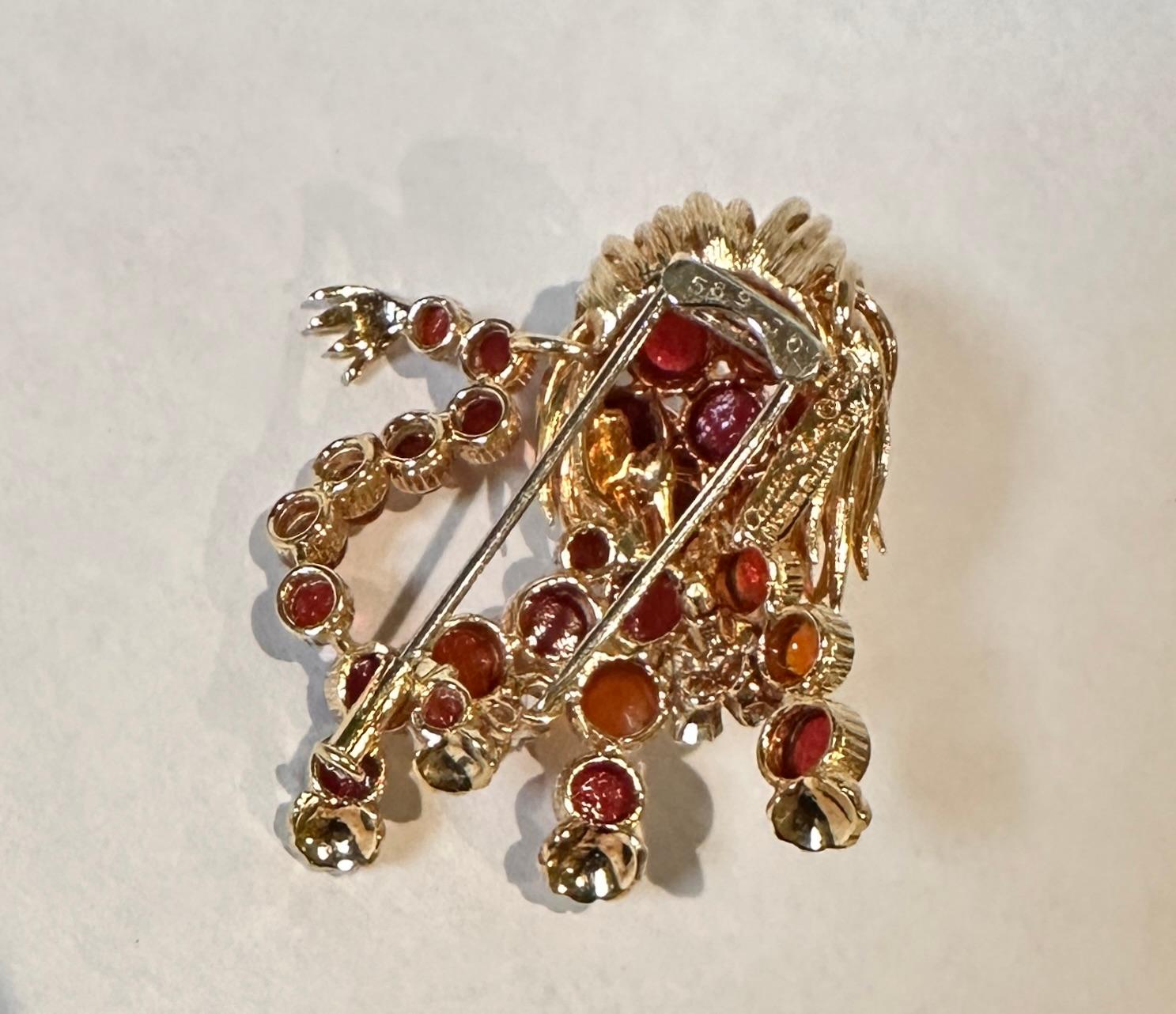 French Cartier France 1960s Yellow Gold Diamond And Red Cabochon Stone Lion Brooch For Sale