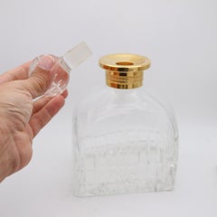 CARTIER Francia 1980 Bottiglia da liquore in cristallo tagliato a mano con collare d'oro dorato