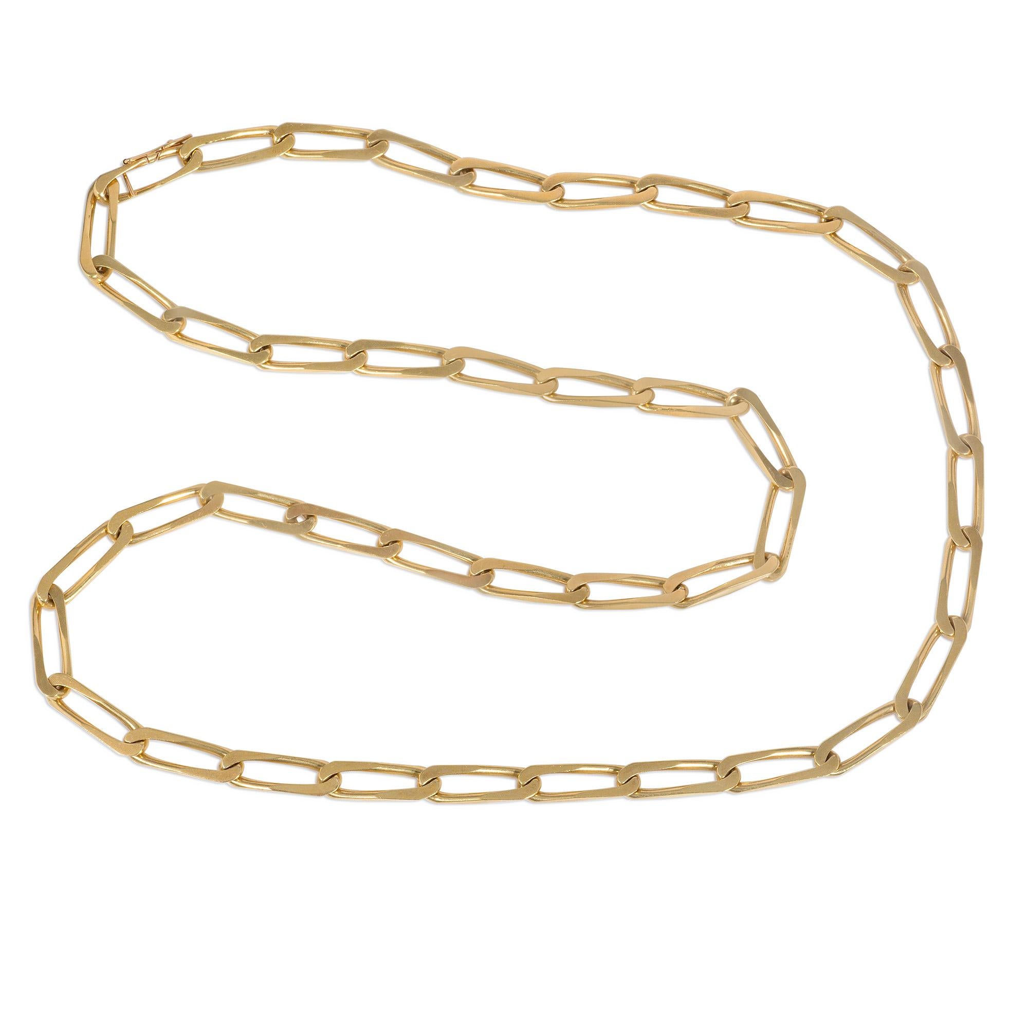 A 1970s gold chain of paper clip links with clasp of like design, in 18k.  Cartier, Paris. #46309.
May be doubled and could easily suspend charms/pendants, or a brooch may be attached as a decorative accent

* Includes Kentshire's letter of