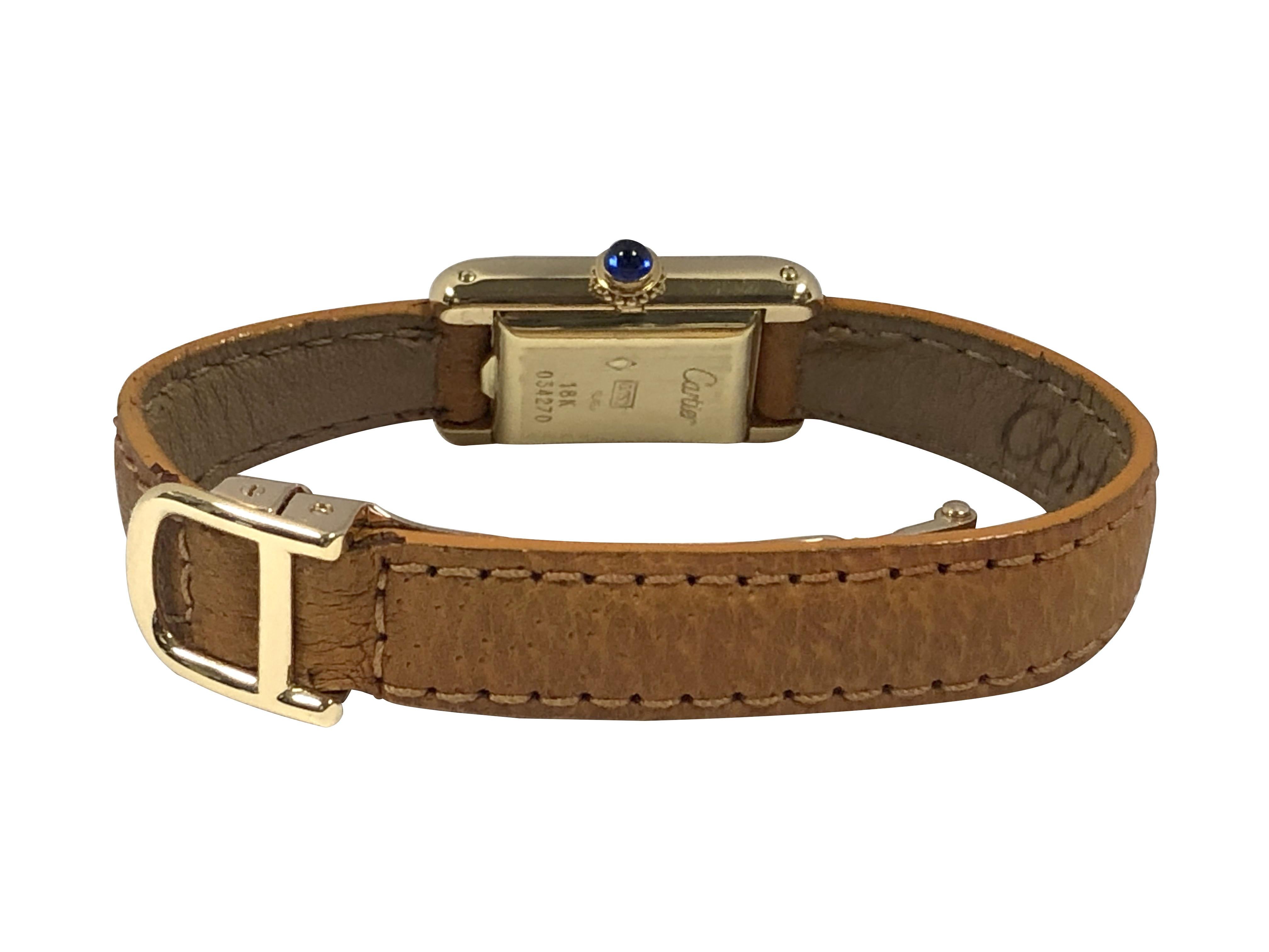 Cartier France, rare montre-bracelet mécanique Mini Tank en or jaune Pour femmes en vente