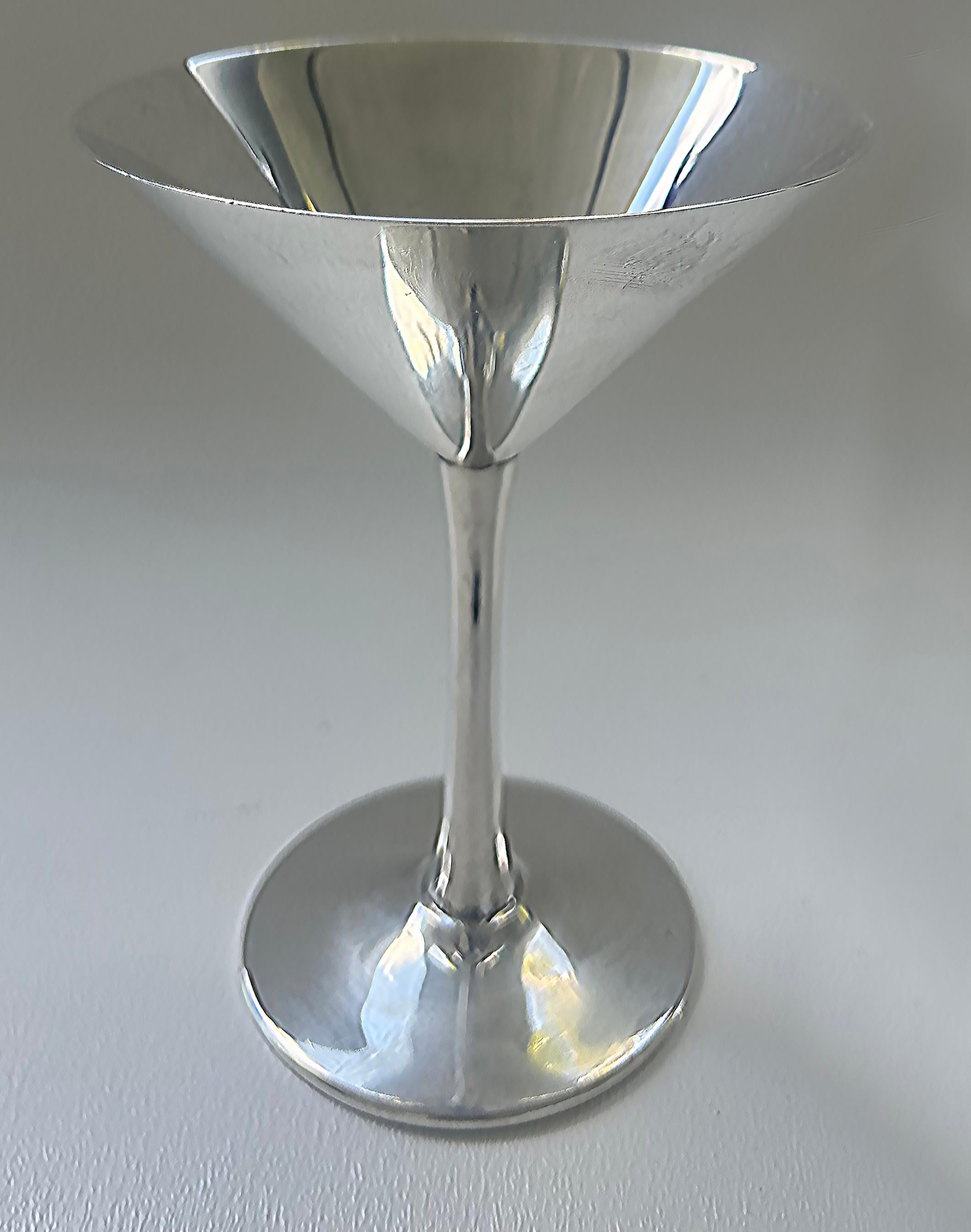 Cartier France Stamped 925 Sterling Silver Martini Goblets- A Pair

Offered for sale is a pair of 925 sterling silver martini glasses from Cartier. The goblets are signed Cartier Sterling on the bases as shown.
