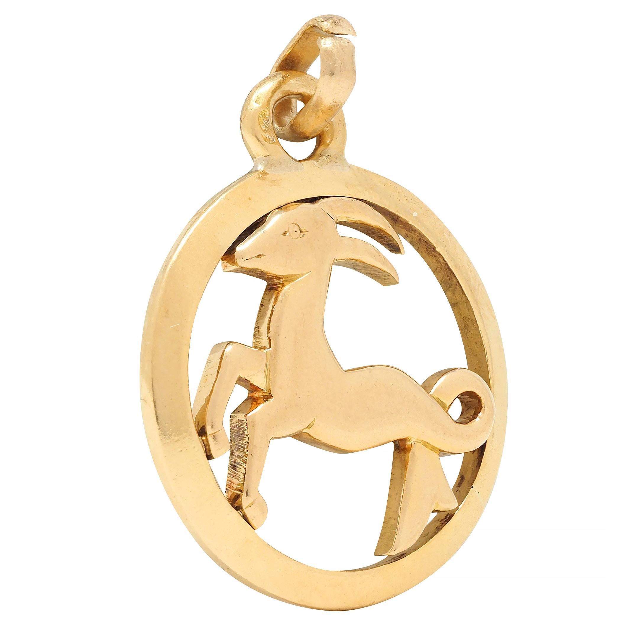 Designed as a stylized Capricorn figure with minimalist features
Centered in a pierced round frame surround
Suspending from jump ring bale
Stamped with French hallmark for 18 karat gold
Numbered and fully signed for Cartier
Circa: 20th