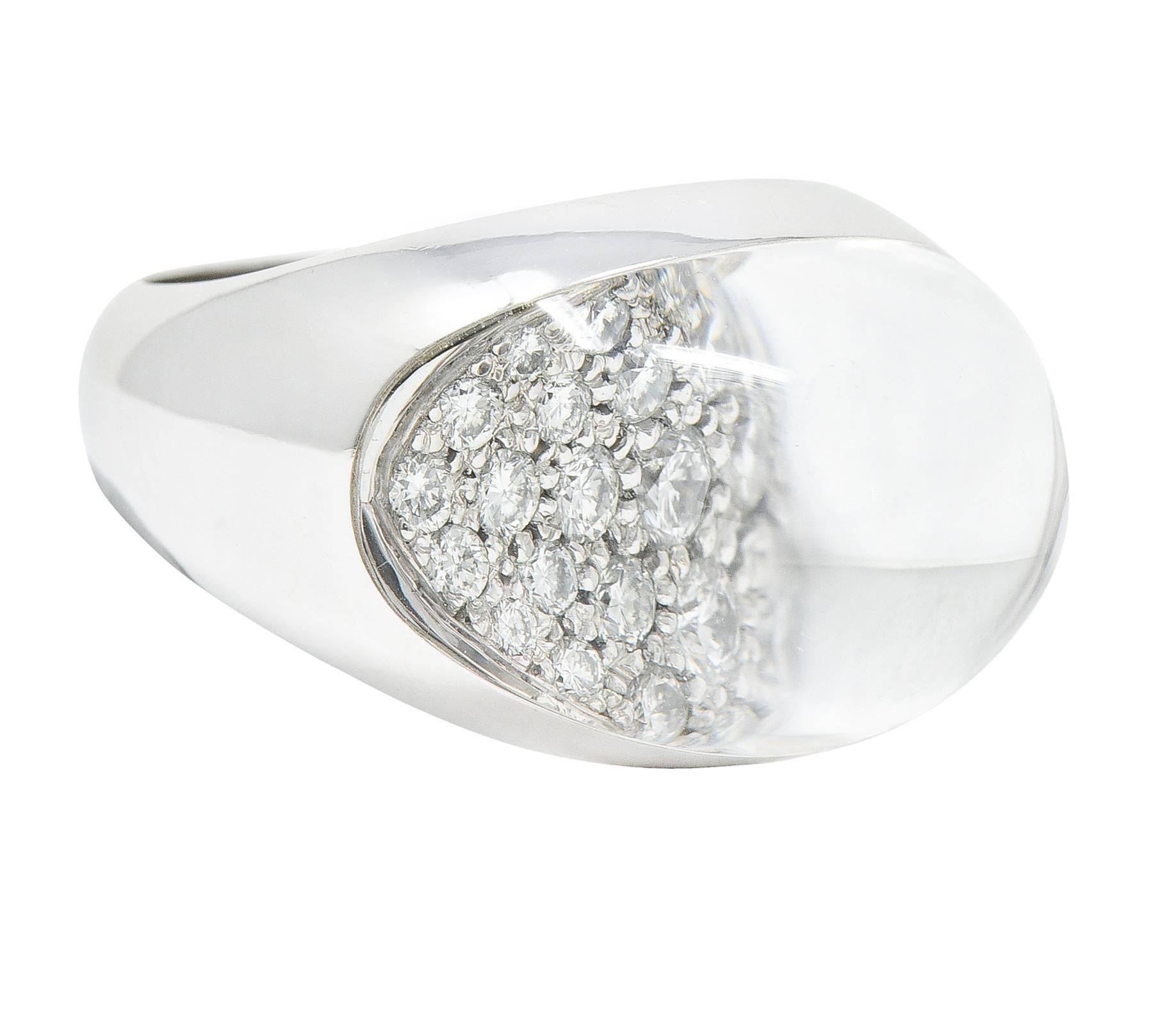 Bombè ring designed as domed rock crystal quartz atop pavè set round brilliant cut diamonds

Quartz dome is transparent, colorless, and magnifies diamonds

With high polished finish

Stamped 750 for 18 karat white gold

Numbered and signed for