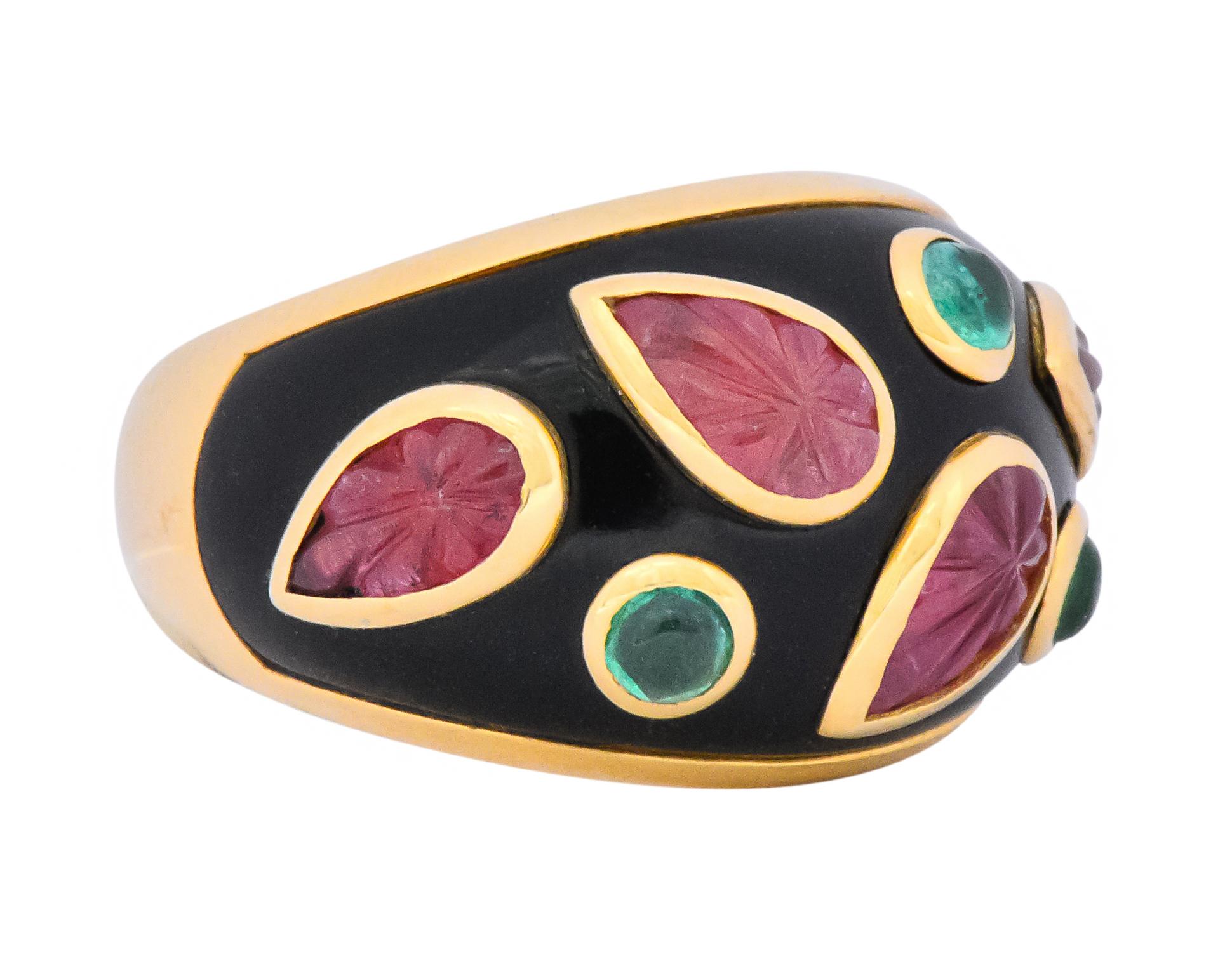 Set to the front with pink tourmaline carved leaves and round cabochon emeralds

All bezel set on a field of black lacquer 

Fully signed Cartier, stamped Cartier, 1991 partial number, 49, 750 for 18 karat gold and French assay marks

Ring Size: 5