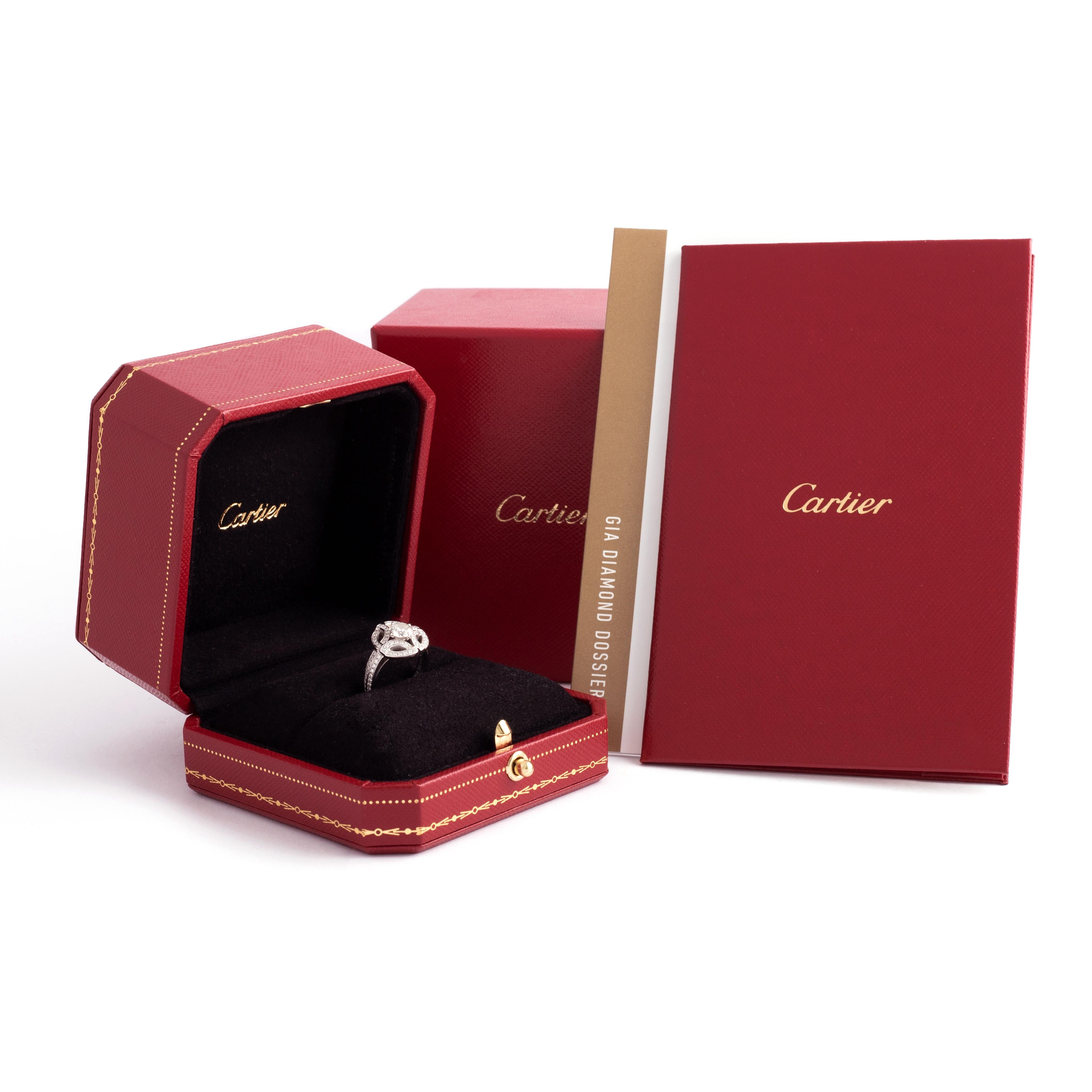 Cartier Galanterie collection Diamond White Gold 18K Ring.
Central diamond round cut, 0.57 carat, H color, Vs1 clarity, Ex, Ex, Ex, Faint fluorescence.
Signed Cartier, numbered.

Cartier original box and certificate.
Gia original certificate for