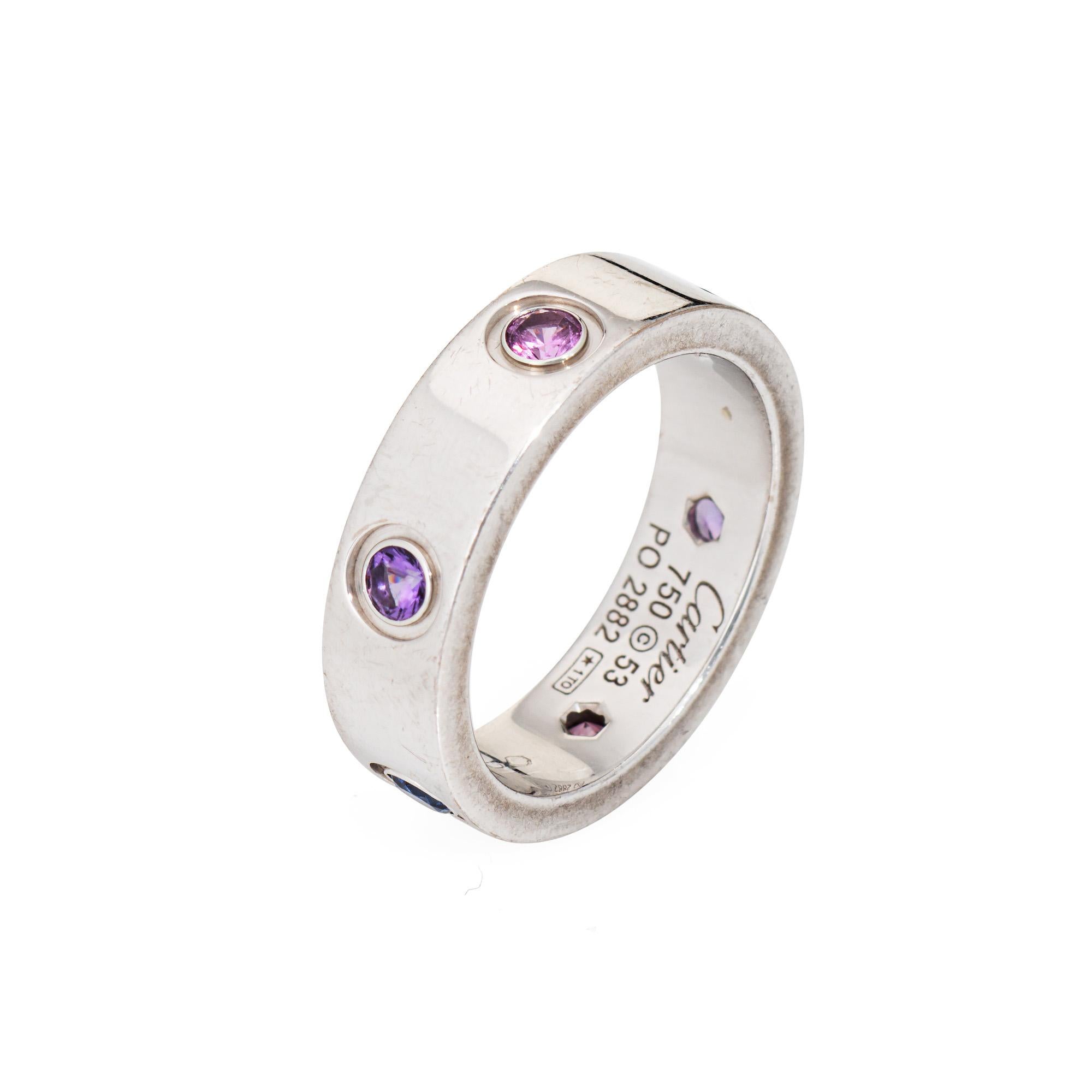 Pre-owned Cartier gemstone Love ring crafted in 18k white gold.  

Purple spinel, aquamarine, pink & blue sapphire and amethyst measuring approx. 3mm are set into the band. Note: few minor surface abrasions to the gemstone visible under a 10x loupe.
