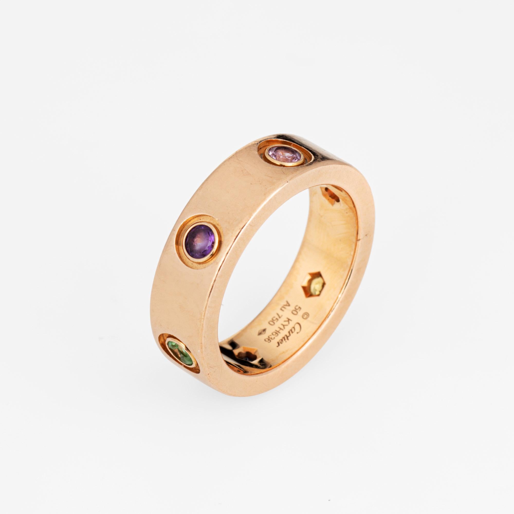 Pre owned Cartier gemstone Love ring crafted in 18 karat rose gold.  

Pink, blue and yellow sapphires along with green & orange garnets & amethyst measure approx. 2mm each. Note: the gemstones show signs of wear including surface abrasions and