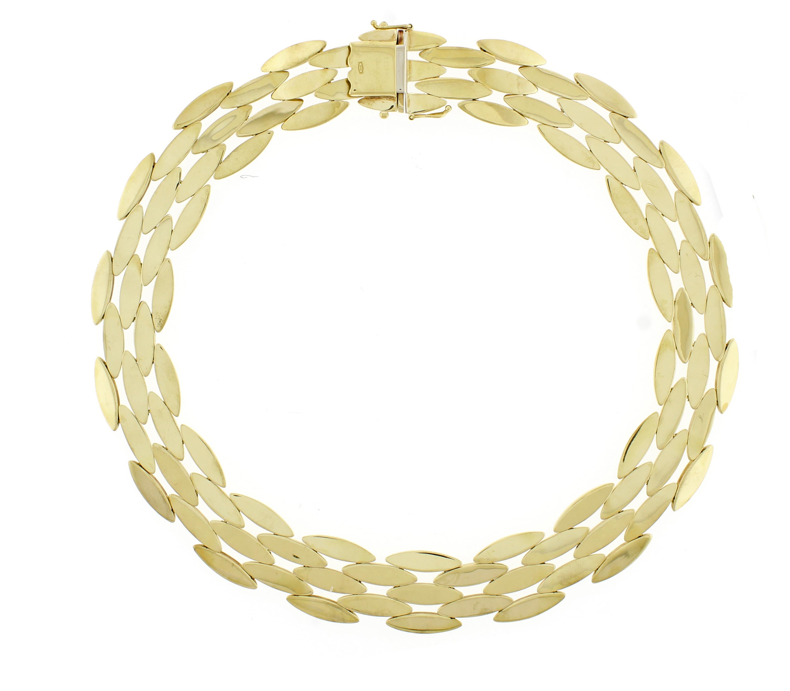 From Cartier iconic Gentiane collection their classic 5 row rice link necklace
• Signed Cartier
• Metal:  18 karat gold
• Circa: 1980s
• Size: 16inches
• 9.65mm wide, a little over an inch	
• Cartier Box
• Condition: Very good
