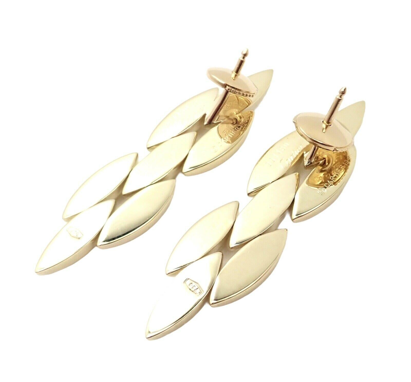 18k Yellow Gold Gentiane Three Row Rice Link Earrings by Cartier. 
Details: 
Measurements: 11mm x 40mm
Weight: 7.8 grams
Stamped Hallmarks: Cartier 750 (*SERIAL*) 1989
*Free Shipping within the United States*
YOUR PRICE: $3,500
Ti685mmld