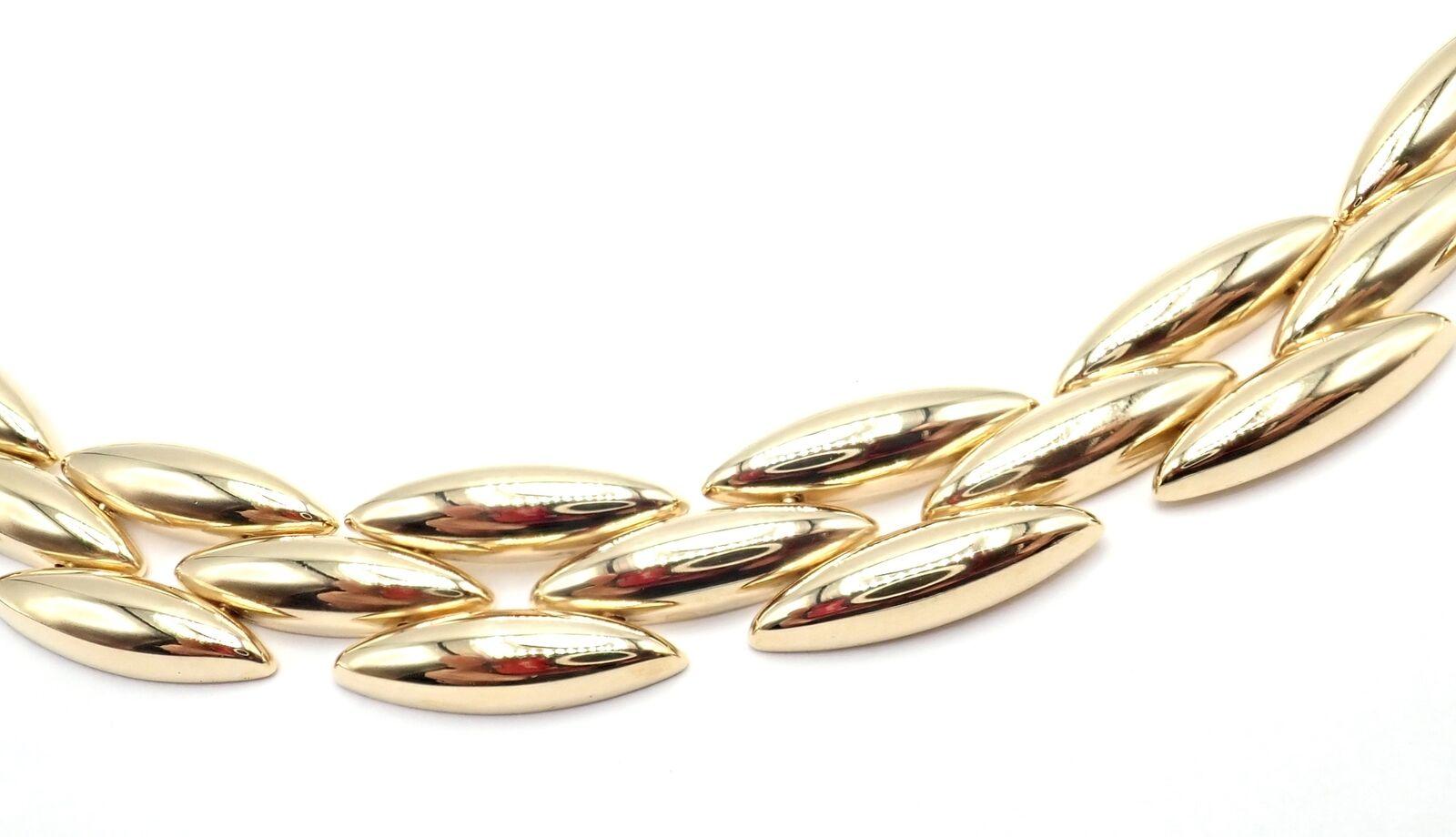 Collana in oro giallo 18k Gentiane 3 Row Rice Link di Cartier. 
Questa bellissima collana è accompagnata dalla scatola di Cartier.
Dettagli: 
Lunghezza: 15,5
Peso: 49.2 grammi
Larghezza: 13 mm
Timbro di garanzia: Cartier 750 B55178
*Spedizione