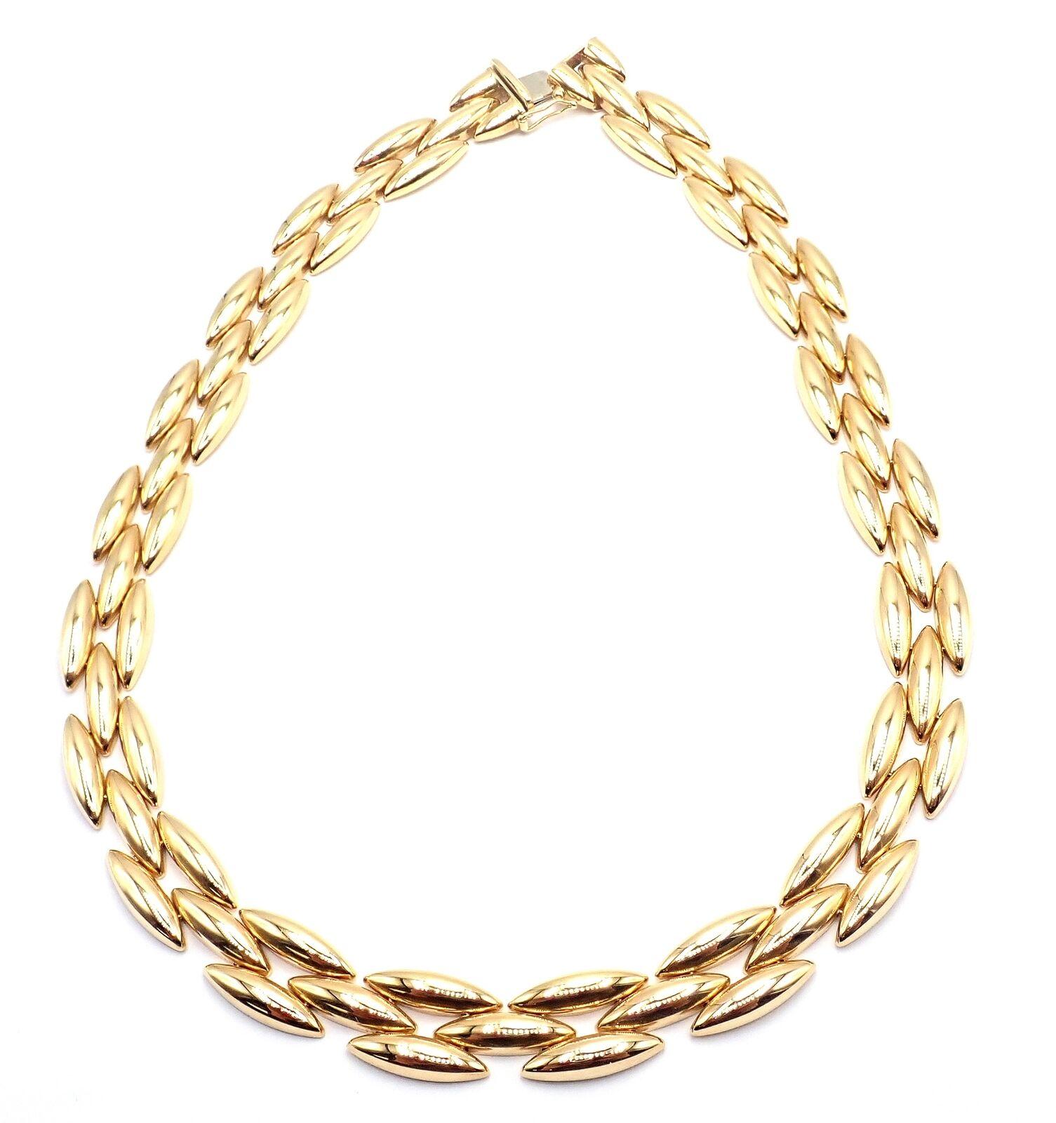 18k Yellow Gold Gentiane 3 Row Rice Link Necklace by Cartier. 
The Cartier Three-Row Gentiane necklace is a magnificent creation, fashioned from 18k yellow gold. 
This piece features elegant rice link chains arranged in three sumptuous layers,