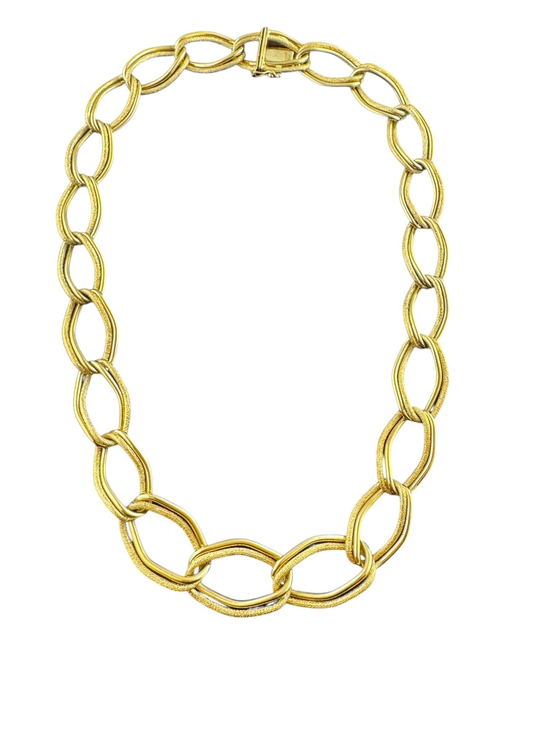 Cartier Germany 18K Yellow Gold Graduated Twisted Oval Link Necklace

This beautiful graduated link necklace is set in 18K yellow gold and features links of textured and polished gold for a luxurious look!

Length: 19