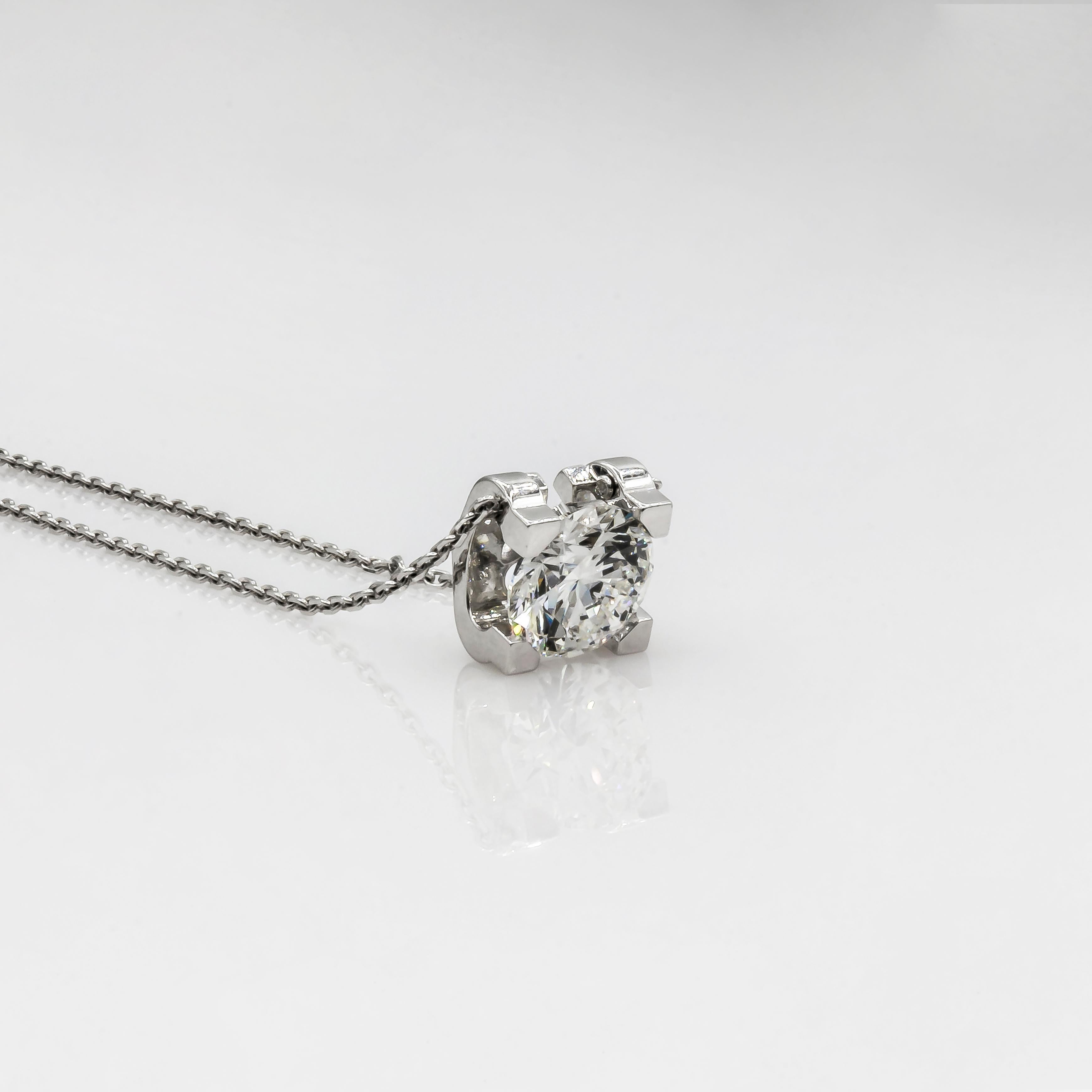 Beautiful and classic Cartier diamond 18K white gold pendant. Features one GIA certified round brilliant diamond 1.70 carat, G color and VS1 clarity. The diamond is Excellent in Cut, Polish and Symmetry with no fluorescence Two letter 