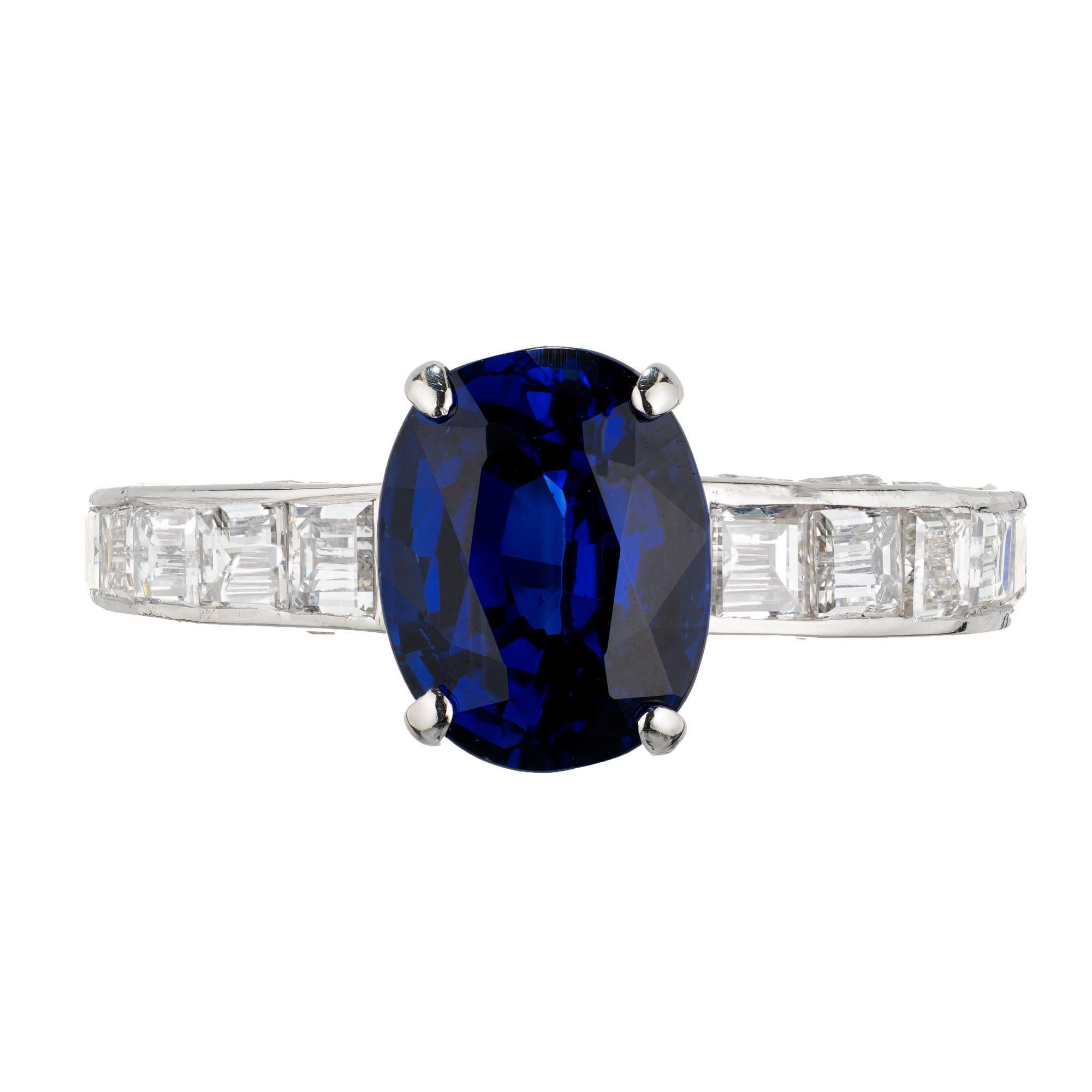 Cartier sapphire and diamond engagement ring. GIA certified oval center stone, Burma Myanmar accented by 34 square cut diamonds, channel set in the shoulders and both sides. Platinum setting. GIA certified 

1 blue oval Burma Sapphire, approx. total