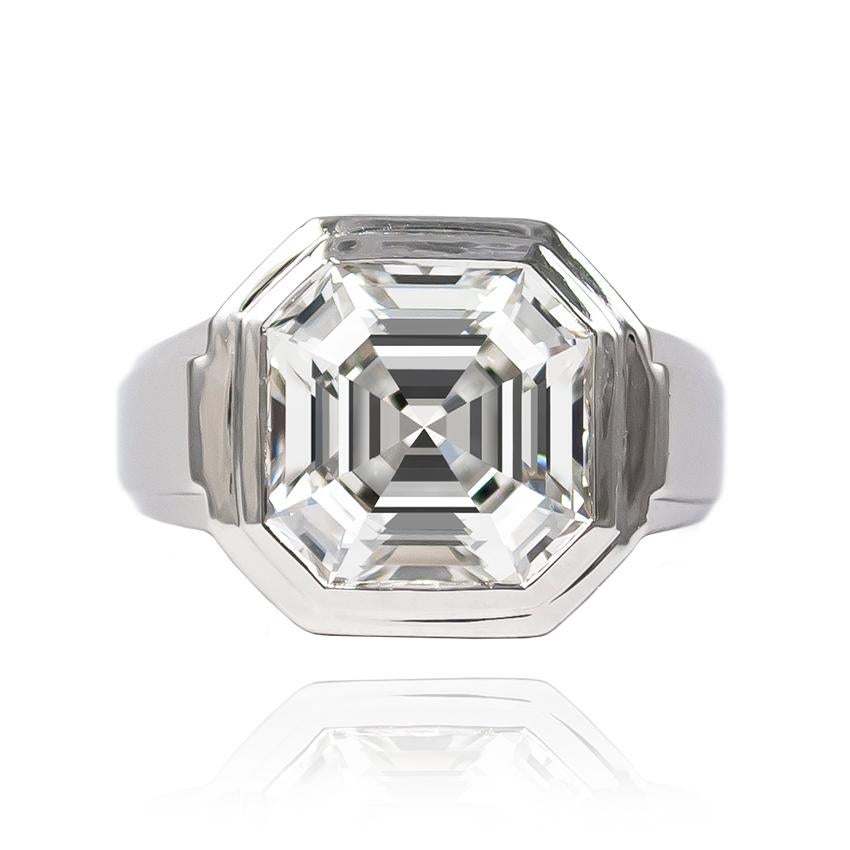 This incredibly elegant and architectural ring from Cartier features a 5.18 ct Asscher cut of J color and VS2 clarity. Bezel-set in a platinum ring, this mounting celebrates the mesmerizing beauty of this step-cut diamond... 

The last three digits