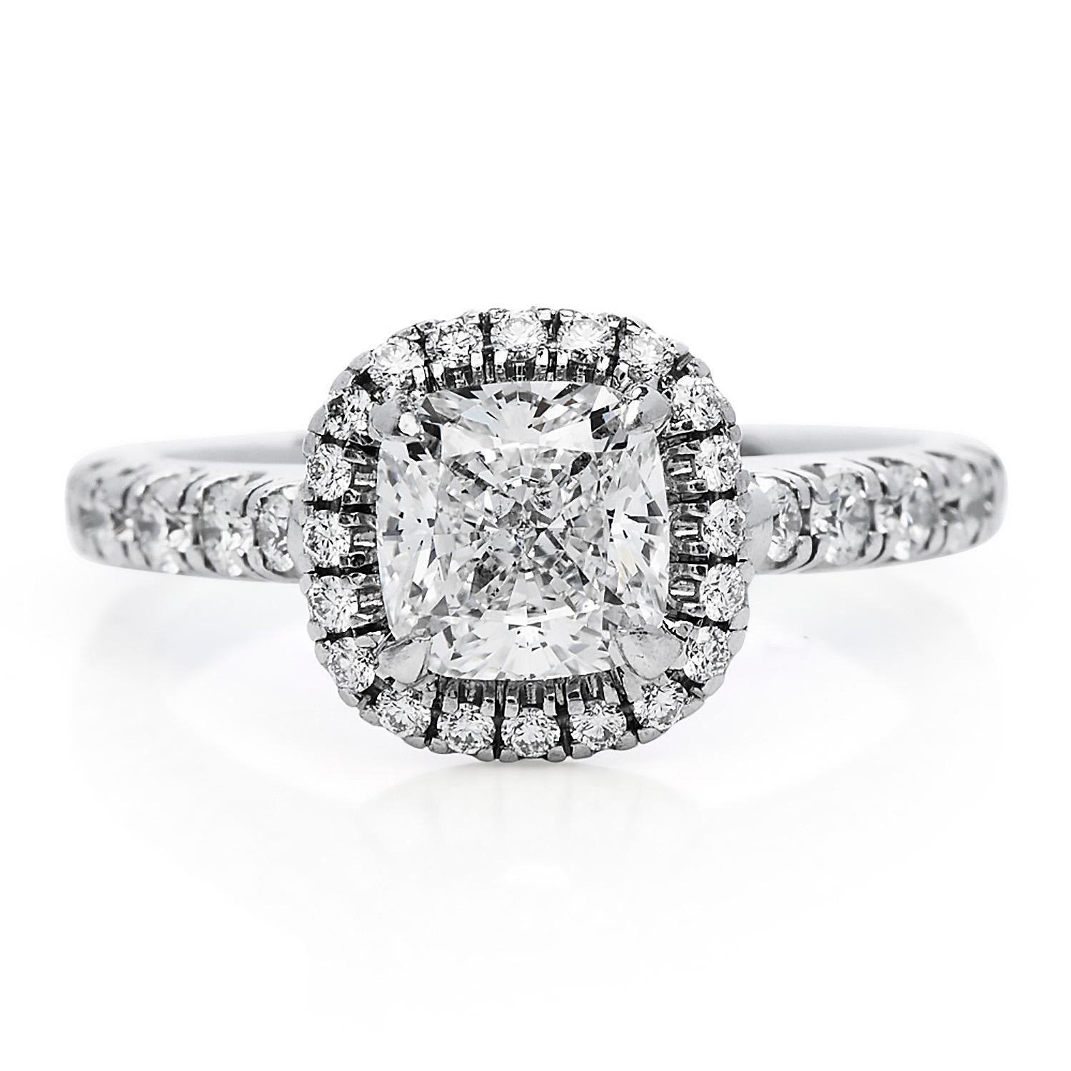 This classic Cartier Engagement ring is crafted in solid platinum,

Featuring a Center Diamond GIA Certified, 1.03 carats Cushion Cut,  F Color VVS 2 Clarity.

Pave set with 26 high-quality round-cut diamonds of approx. ---cts, E-F  color VVS1