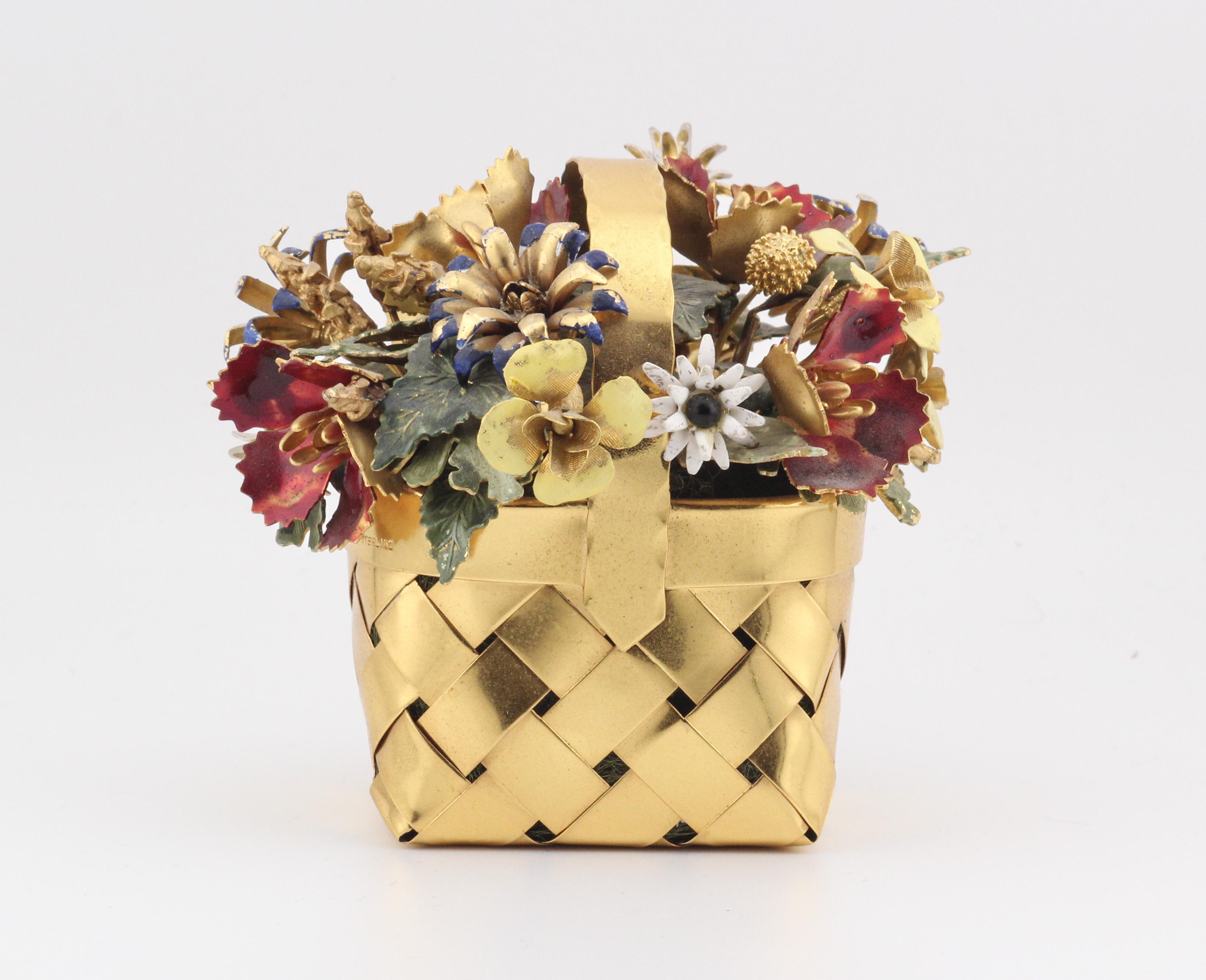 Introducing a masterpiece of elegance and refinement, the Cartier Gilt Silver Enamel Flower Basket, a creation designed by the renowned artist Jane Hutcheson. This exquisite piece embodies the essence of botanical beauty, meticulously crafted to