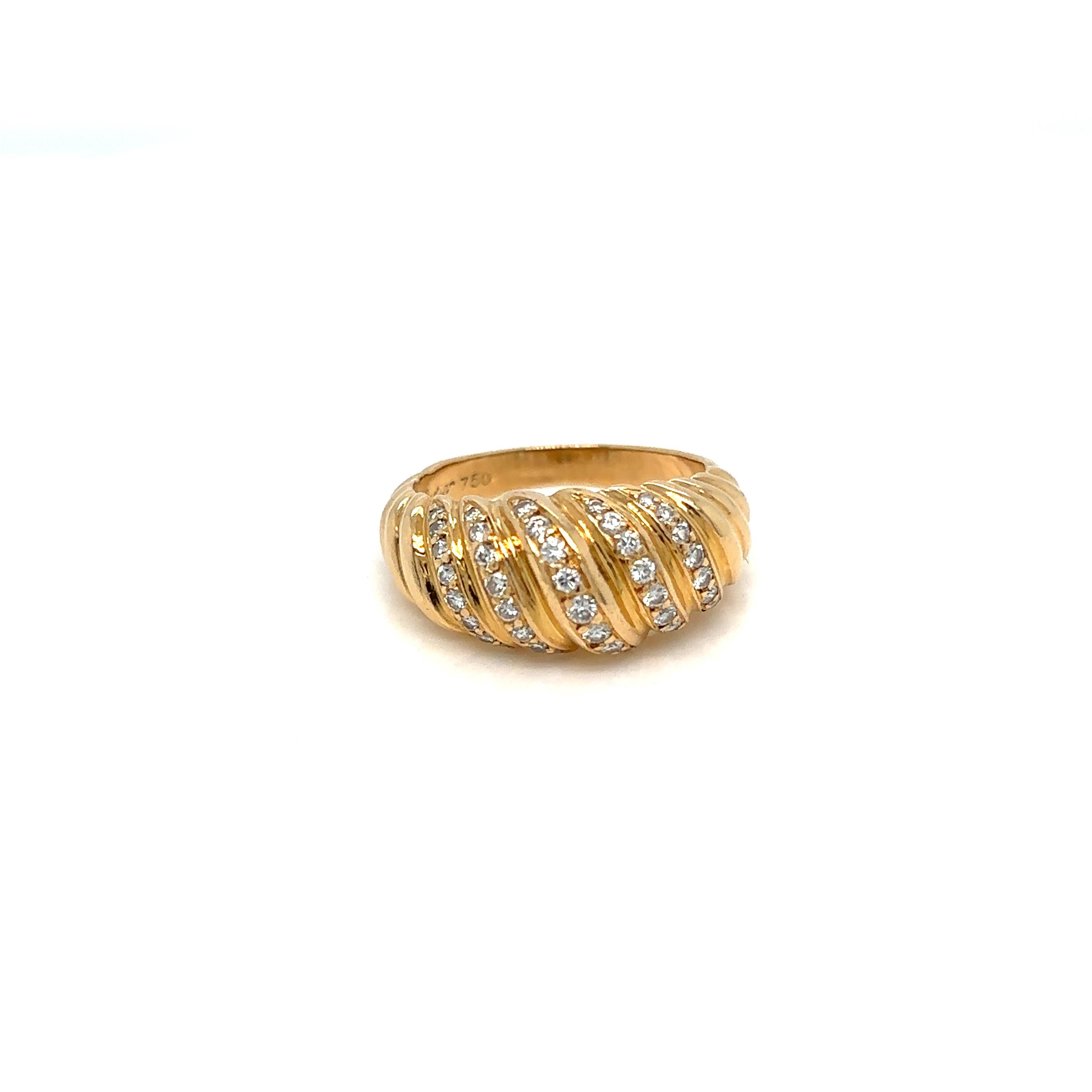 Cartier Diamond Ring in 18ct yellow gold and set with round brilliant cut diamonds, 5 lines total .70 ct F color IF. Vintage, circa 1980

Signed Cartier 750, numbered, eagle and goldsmith head punch on the outer ring.

Weight 6,6 grams
Size 7,