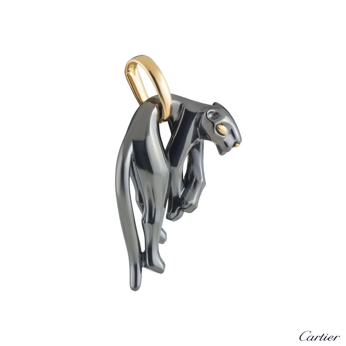 An exquisite 18k yellow gold and silverium Cartier pendant from the Panthere collection. The pendant comprises of a panther motif hanging from the waist with a loop bail to allow for different chains to be worn. The motif measures 4.5cm in height