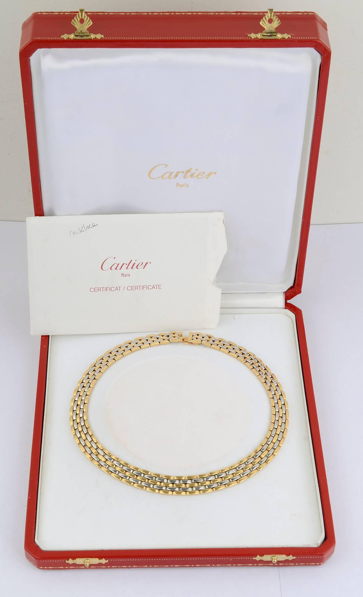 Classic Cartier Panthere choker necklace of alternating links of 18 karat gold with steel. The necklace measures 16 inches long and half an inch wide. It is numbered 780334. The necklace is  accompanied by Cartier box and certificate of authenticity.