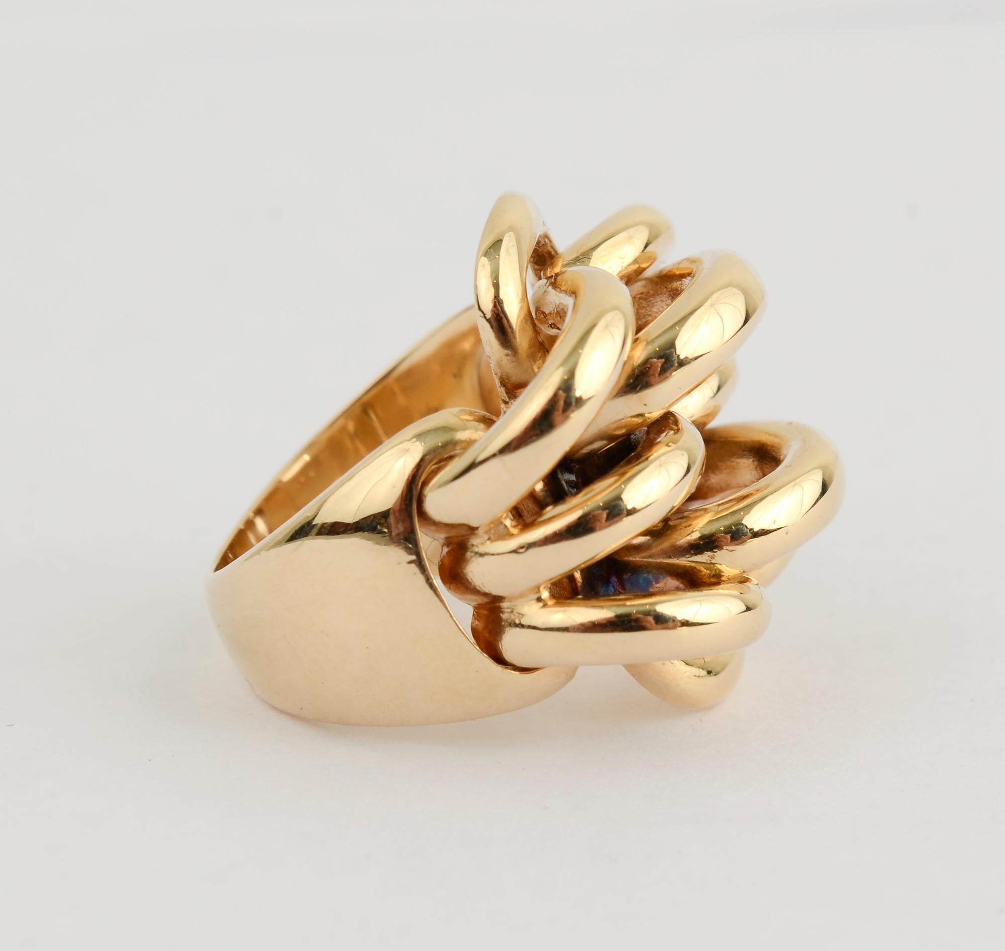 Stylish, unusual ring by Cartier consisting of five rows of arched bands of gold. The arches are of alternating heights.
The ring is size 5. It can easily be sized up or down.