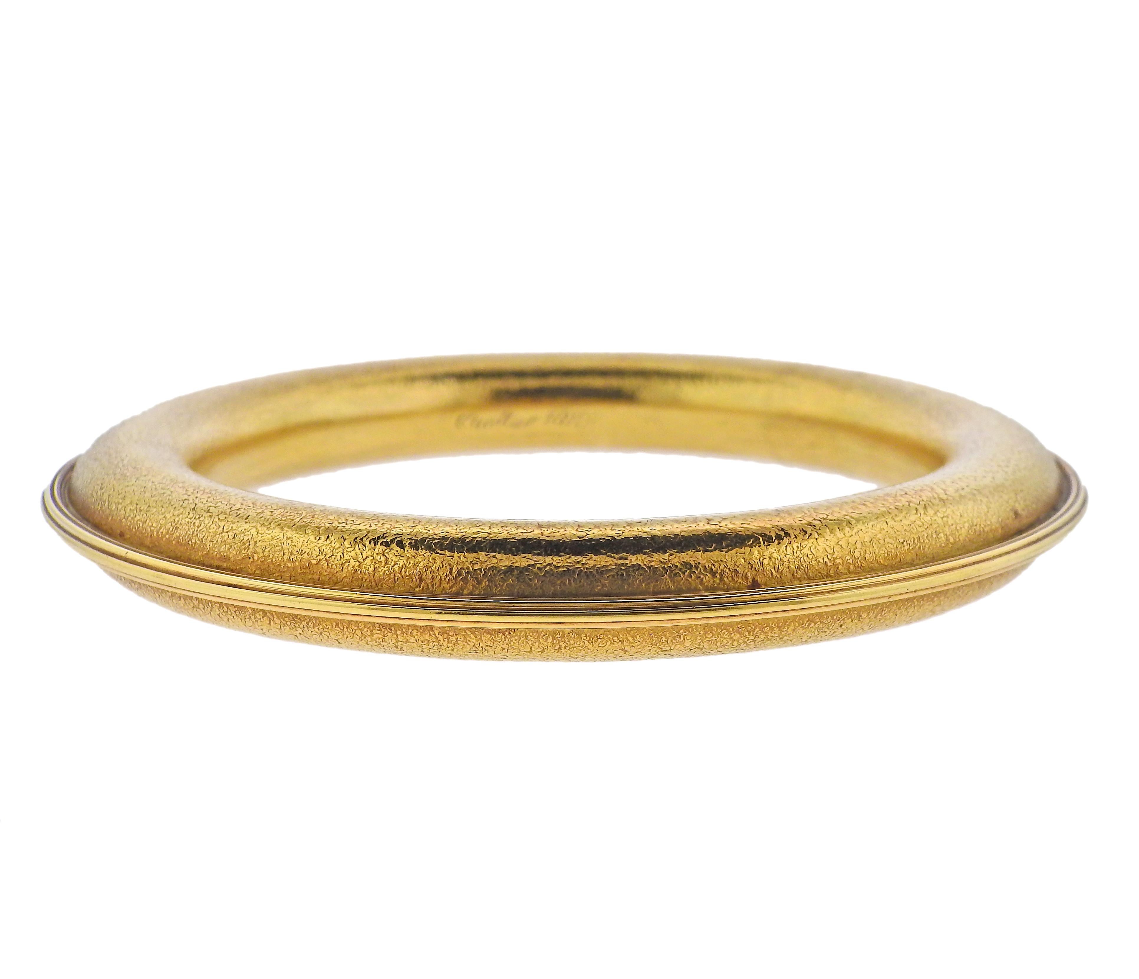 Whimsical 18k textured gold arm cuff bracelet by Cartier. Inner diameter is 3