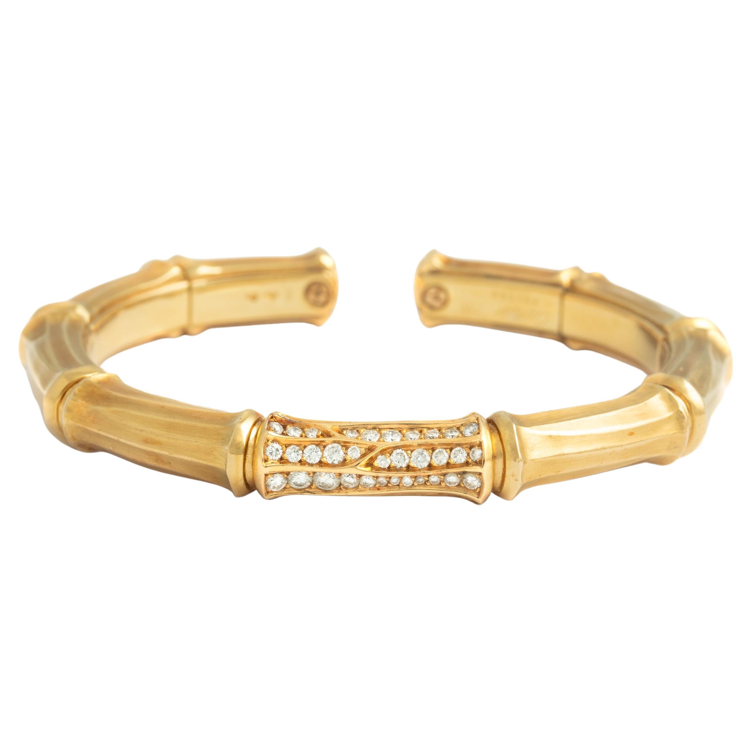 Cartier vintage elegant 18K gold and diamond bangle bracelet in the desirable 