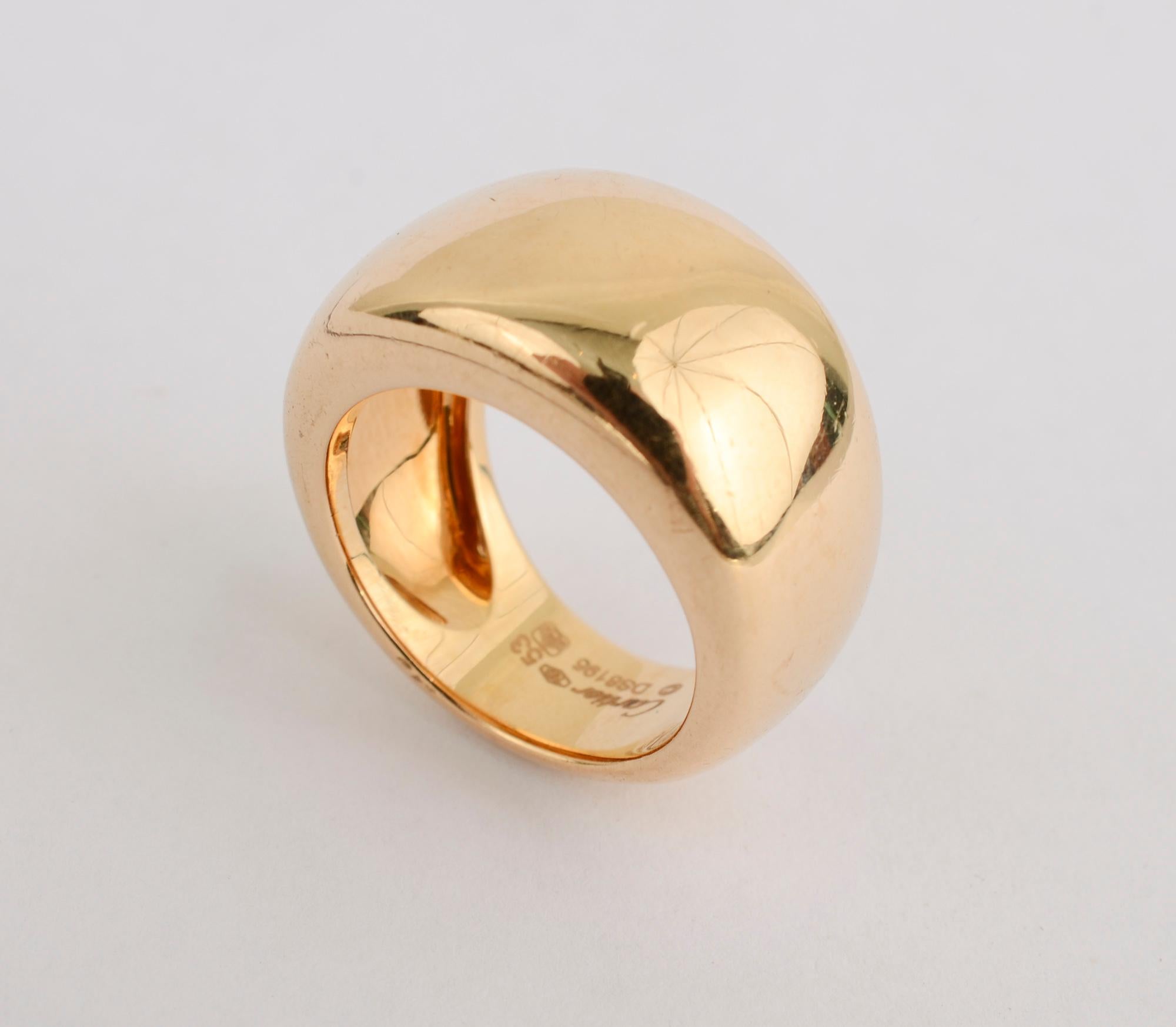 This Cartier ring is the ultimate in elegant simplicity. The ring is half an inch from front to back tapering to one quarter of an inch on the shank. It is slightly domed. The ring is size 6 1/4 but can be sized up or down. The large areas of glossy