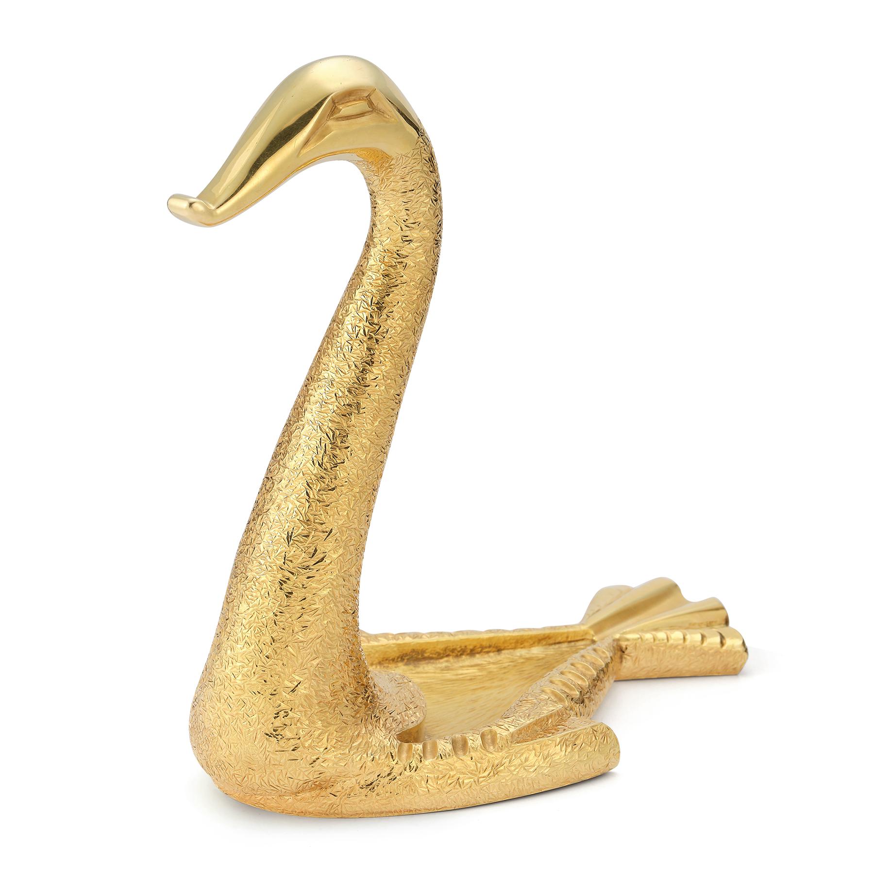 Cartier Gold Bird Pocket Watch Holder  
circa 1950 
18k hammered yellow gold watch holder & ashtray
With copy of Cartier sketch

Measurements:
 Length: 5.75