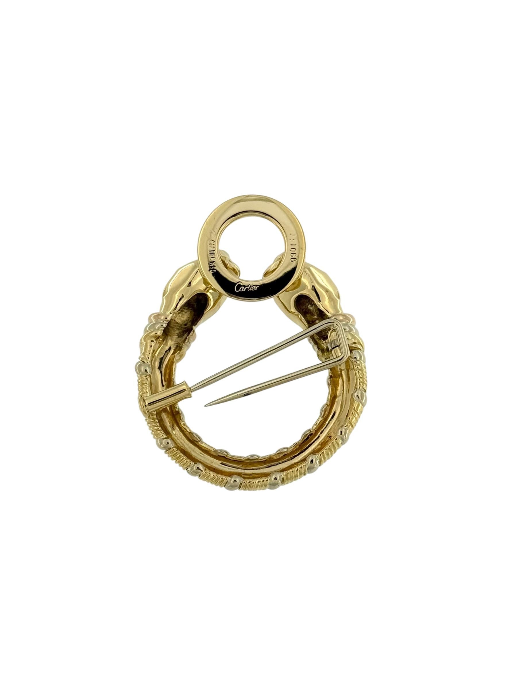 The Cartier Double Panthère Head Brooch is a striking symbol of power and elegance, crafted in 18kt triple gold—a signature combination of yellow, white, and rose gold. This exceptional piece showcases two sculpted panther heads, facing each other