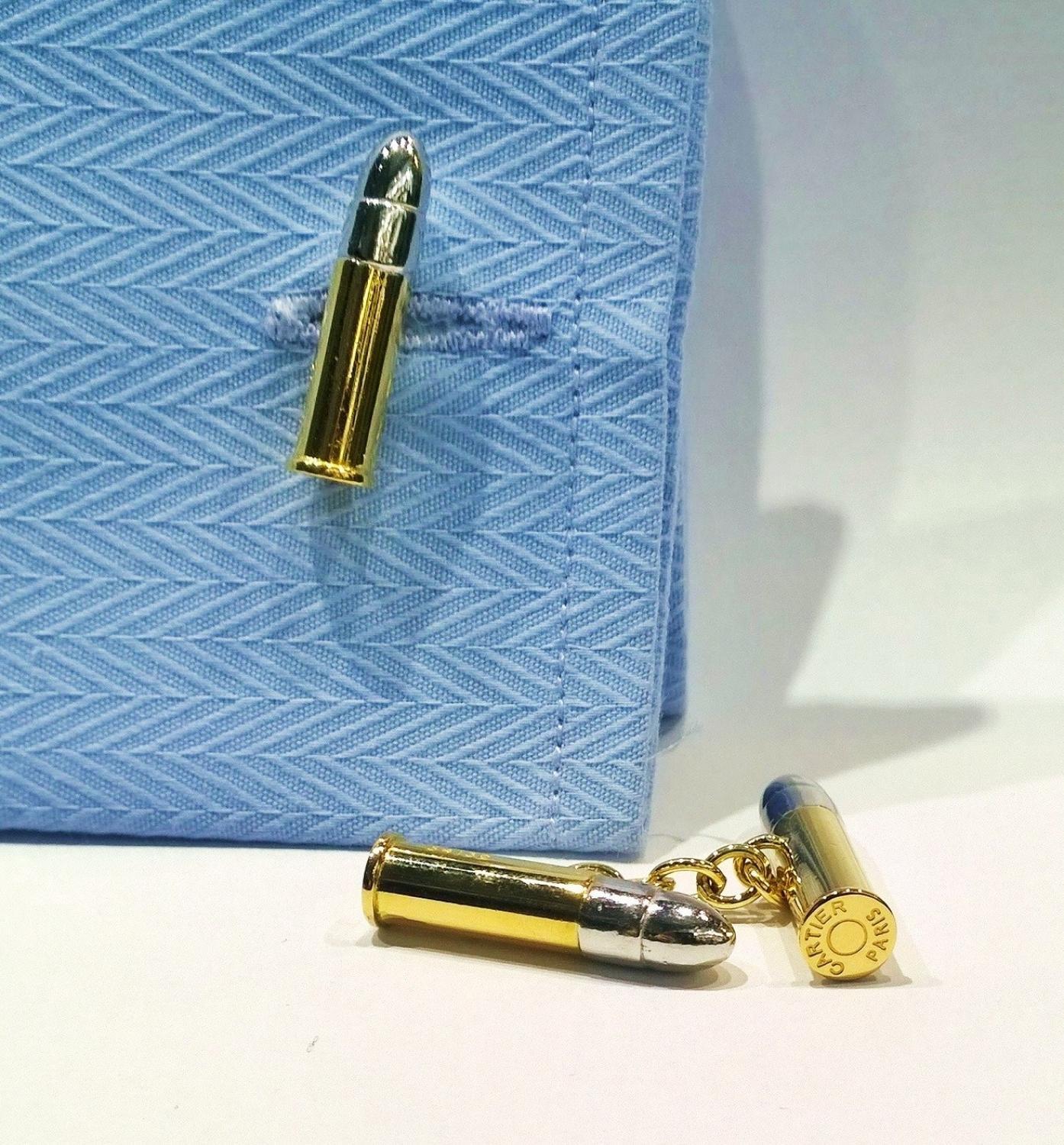 These are Gorgeous CARTIER cufflinks from our Estate department.

These CARTIER cuff links are from Vintage 1960's.

The Bullet Cases are done in 18K Yellow gold and the Tips are 18K White gold. They are Designed as .22 caliber Bullets joined by an