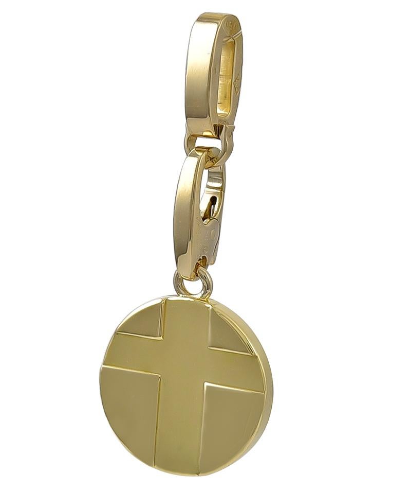 A heavy gauge 18K yellow gold charm, with a deeply carved 