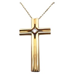Croce Cartier in oro e diamanti