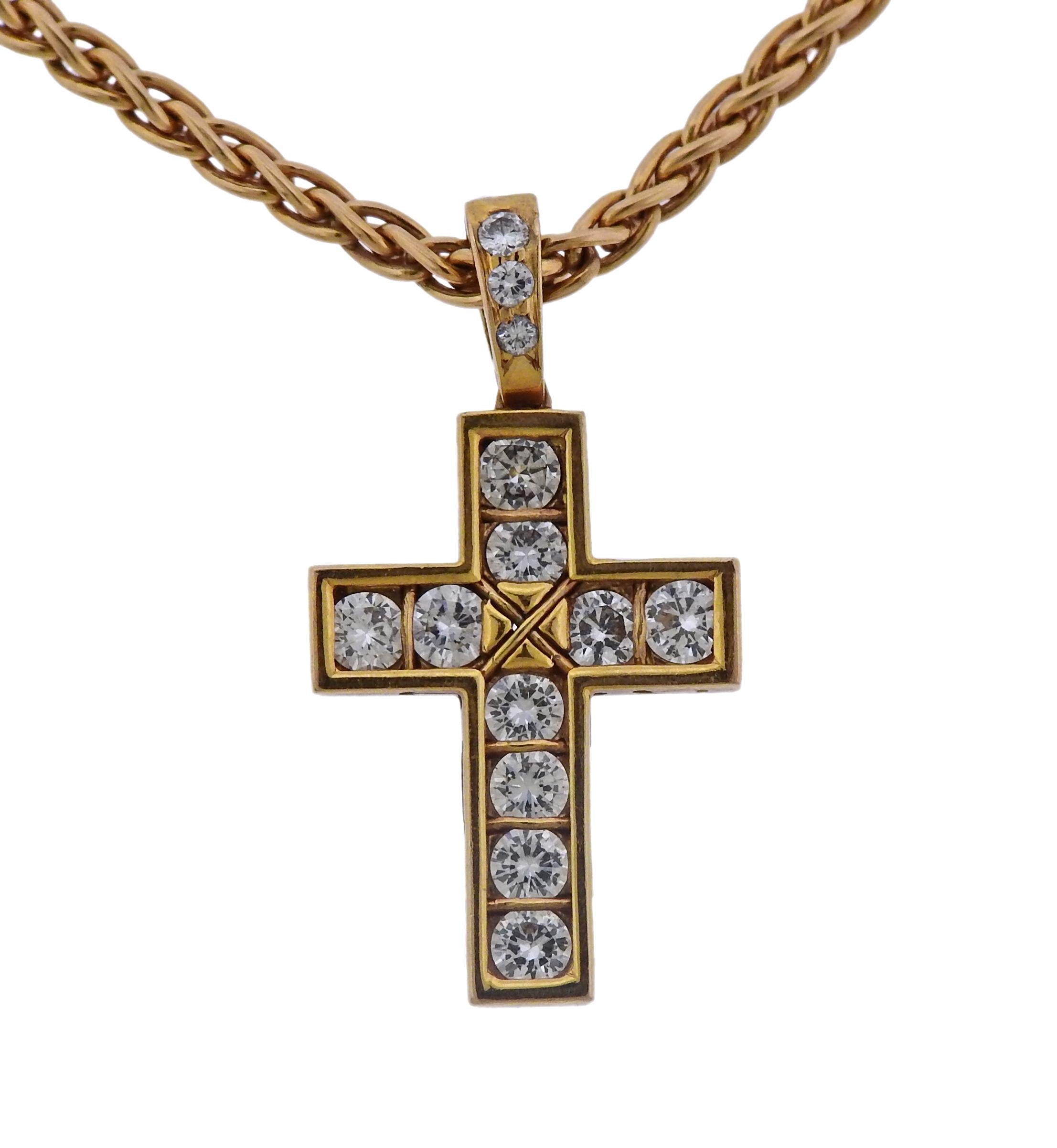 18K yellow gold chain necklace with cross pendant, decorated with approx. 0.85ctw in G/VS diamonds, crafted by Cartier. Necklace is 16.5