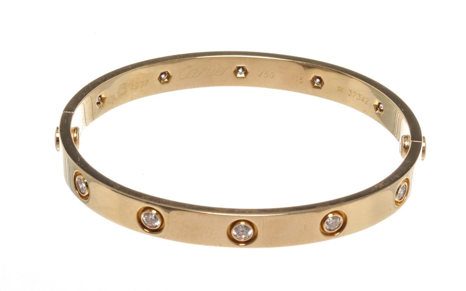 Cartier Gold Diamond Love 16 Bracelet with gold-tone hardware. Dated in 1997 having the older screws. Comes with the screw but no box.

M37342


52778MSC