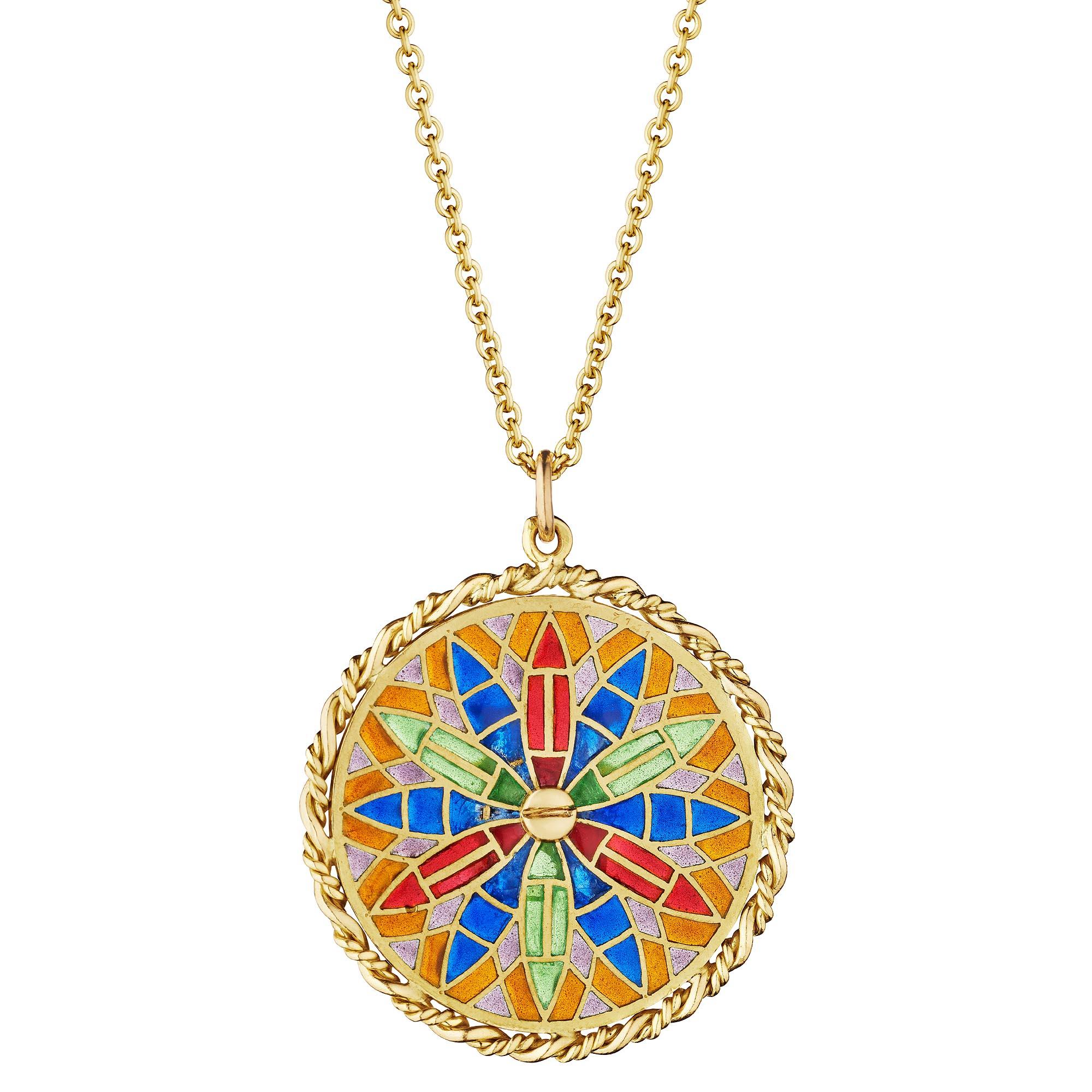The cathedral of Notre Dame, a symbol of France, reflects peace and harmony, and this Cartier vintage gold and plique-a-jour enamel charm pendant necklace honors that powerful image.  With a stained glass style enamel patterned background featuring