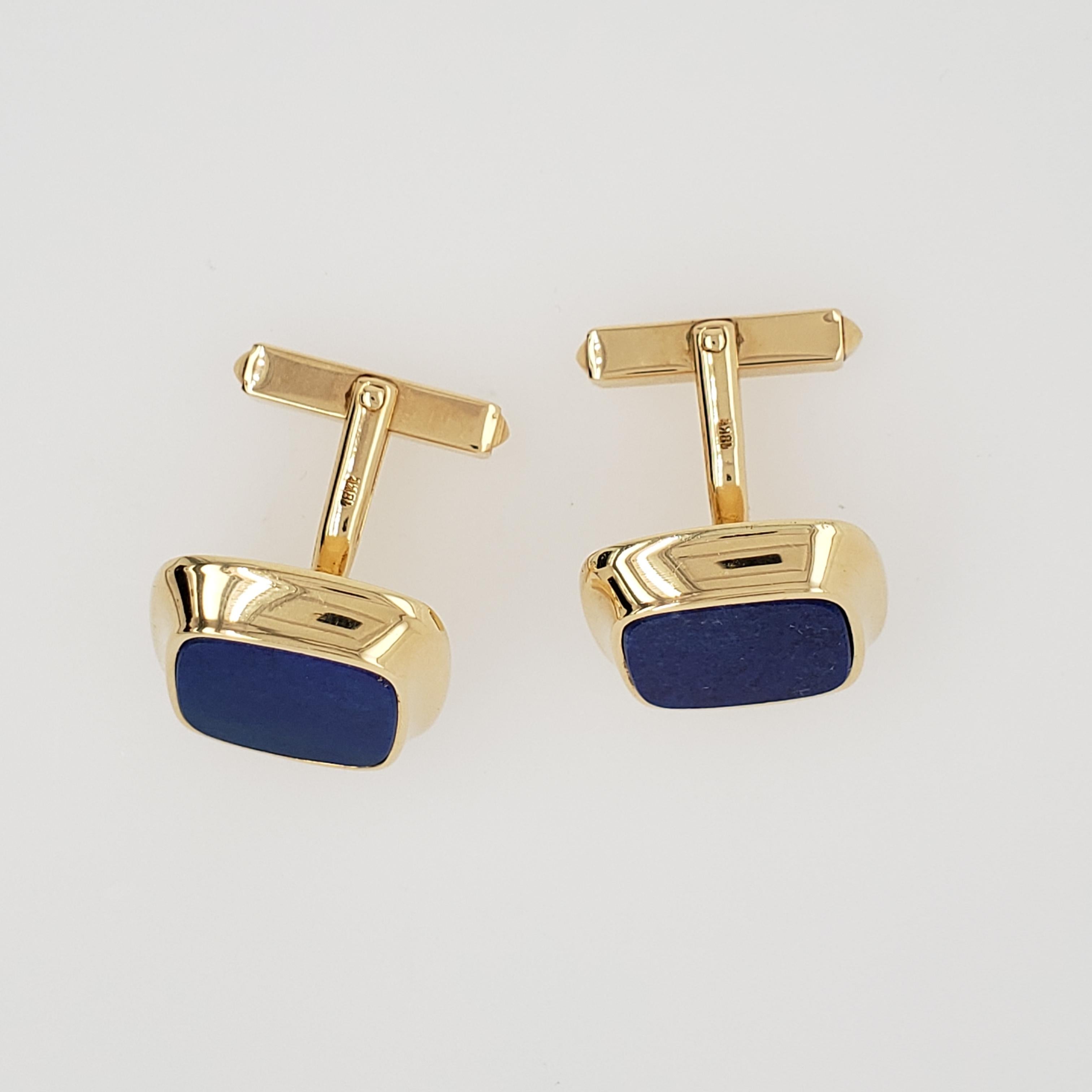 Vintage 18kt Yellow Gold Cartier Hallmarked Lapis Lazuli Cufflinks. The cufflinks are cushion cut in style. The cufflinks were made in Germany. Circa 1980's.