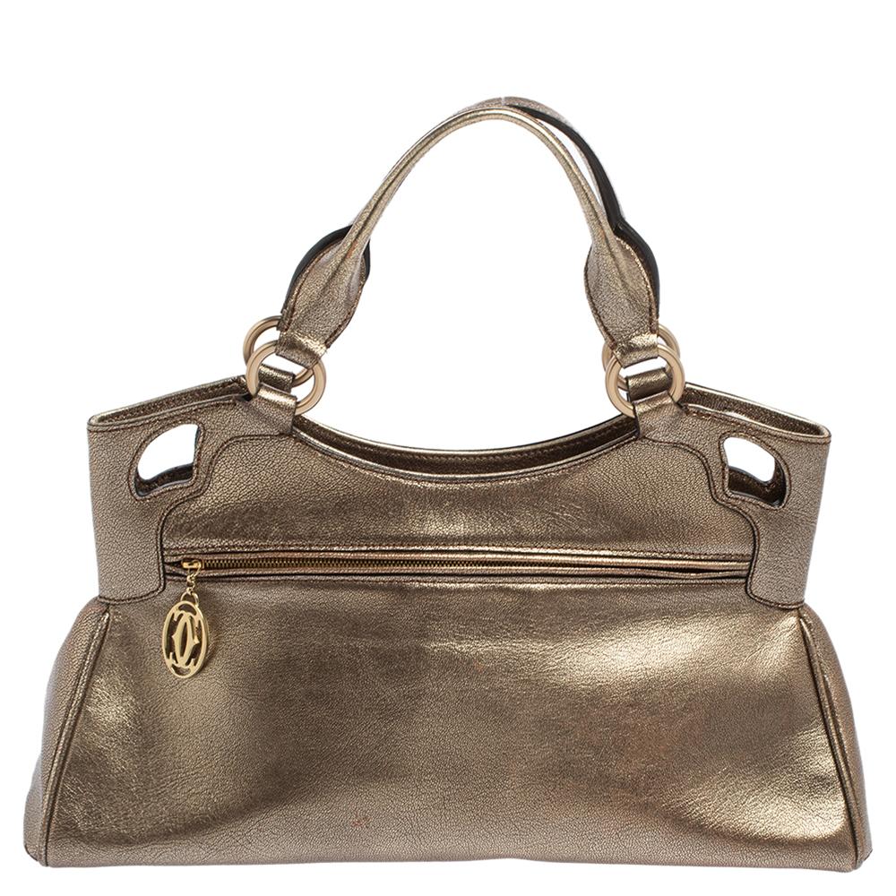 This Cartier beauty arrives in a gorgeous shape and design. It has a leather body with the logo detailing on the exterior and is held by two handles. The zipper secures the fabric interior and overall, the Marcello De Cartier bag looks ready to lift
