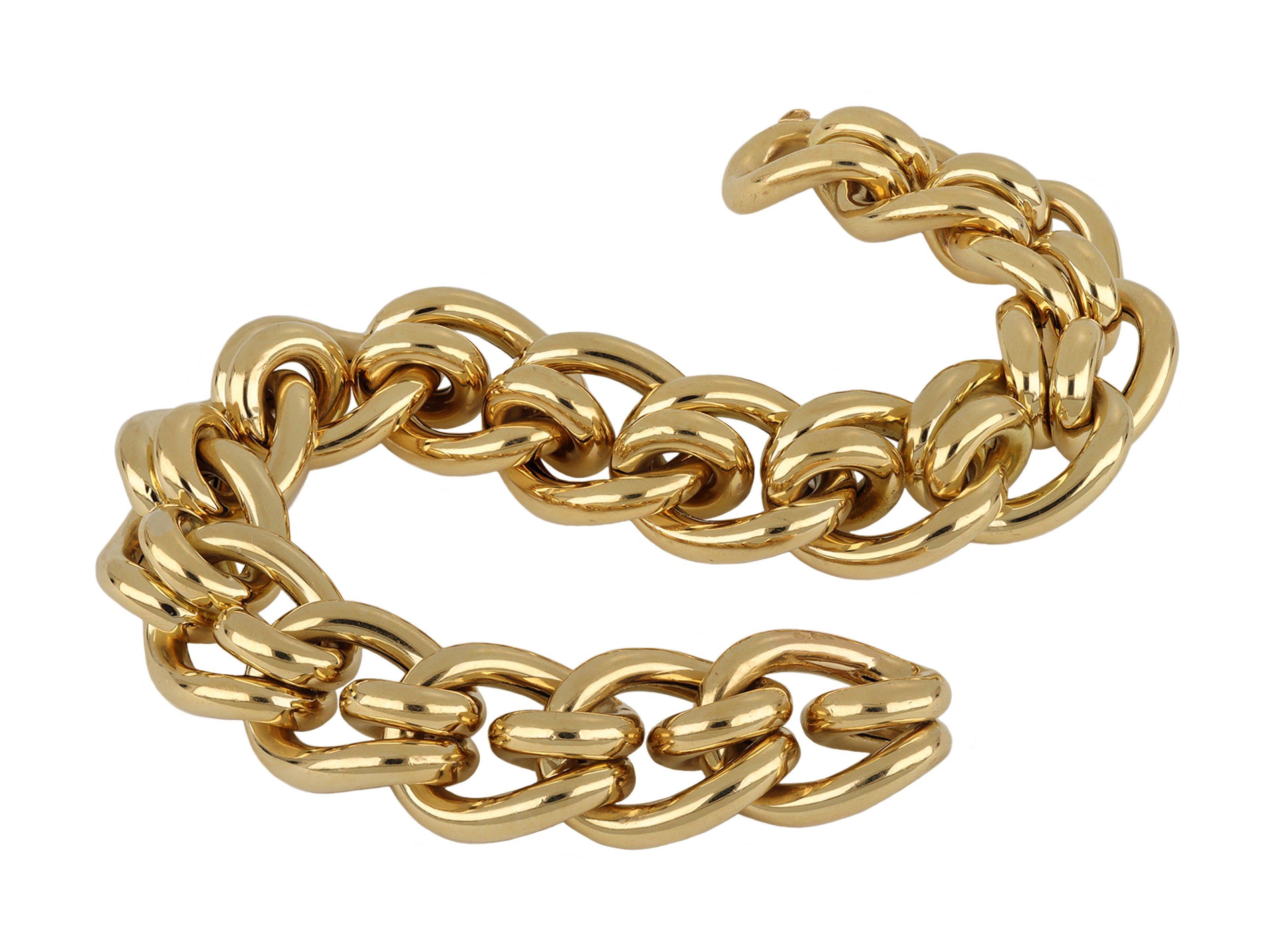 Cartier gold mousetrap link bracelet. A yellow gold articulated bracelet comprised of seventeen sections of tubular woven mousetrap links, flowing with movement and fitted with a secure integrated clasp and safety catch, approximately 7.5
