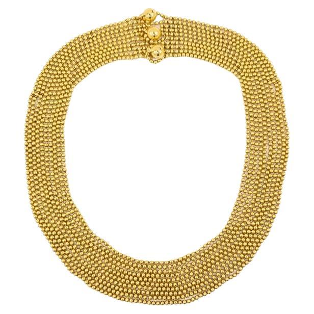 Una spettacolare collana Cartier Draperie a 10 fili in oro 18 carati. Questa collana d'oro di Cartier porta con sé  fluidità e movimento, ispirati dal drappeggio di un tessuto morbido. Presenta file di perline dorate a cascata, che creano un effetto