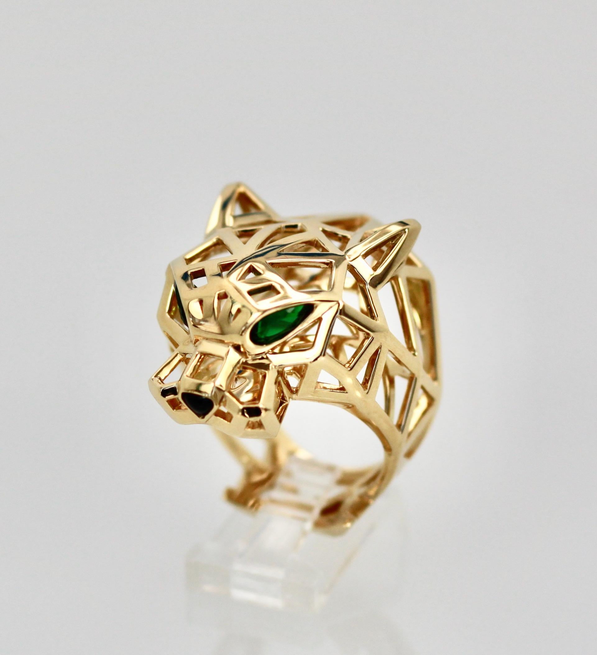 This classic Panthere ring is open with a pyramid shape and has Emerald eyes and Onyx nose.  Retail $20,800. Size French 68 US 12.  Comes in Cartier travel pouch