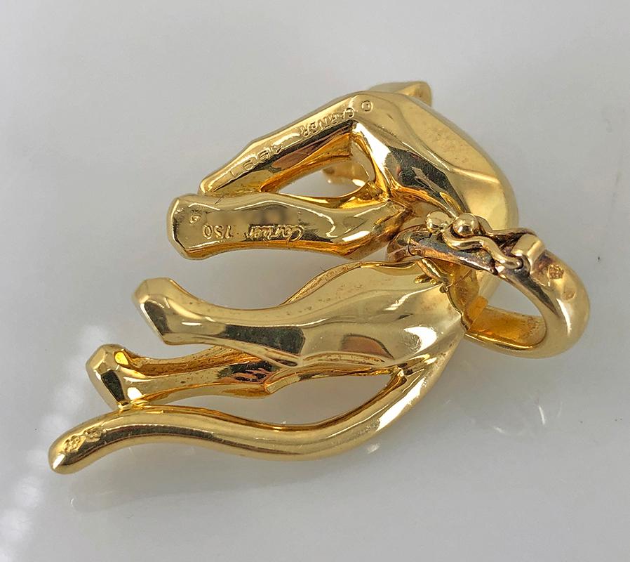 An exceptional piece portraying Cartier’s most iconic creature, the great Panther set in an 18k gold pendant brooch.

Signed Cartier.
Dimensions – approx. 1″x1″